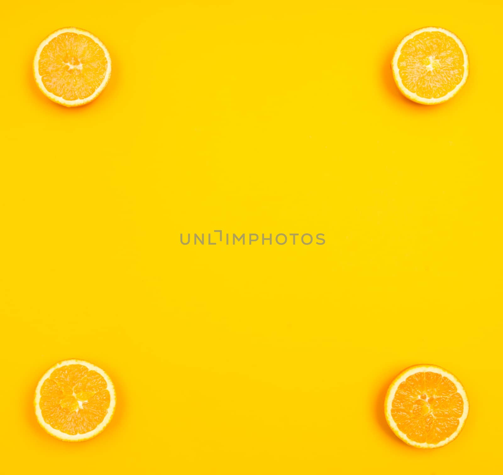 Orange pattern on orange colored background citrus arrangement