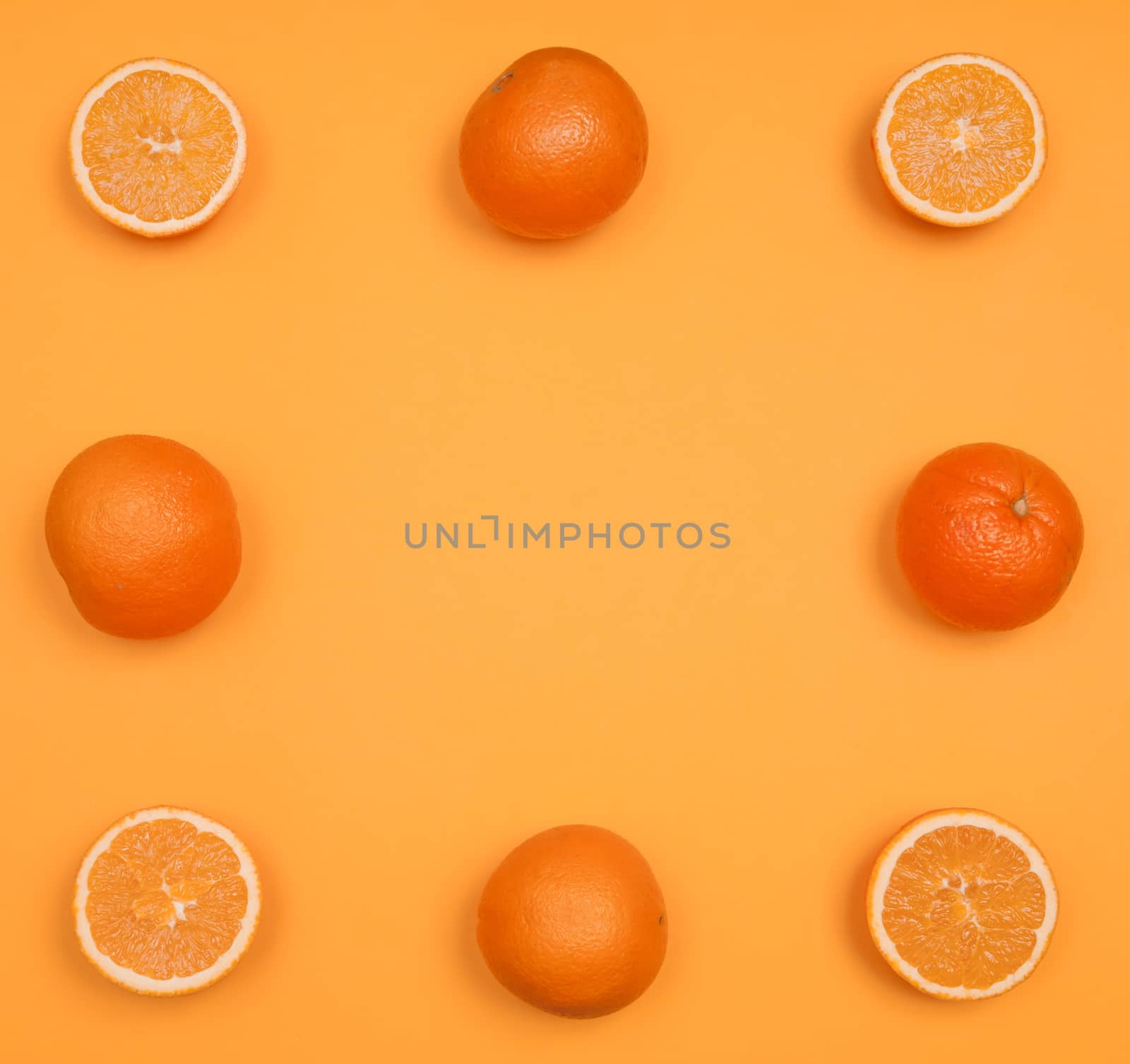 Orange pattern on orange colored background citrus arrangement