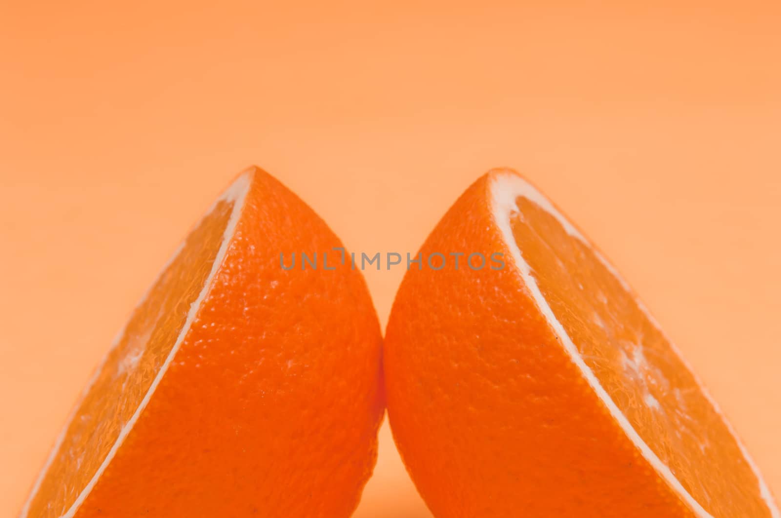 Orange pattern on orange colored background citrus arrangement