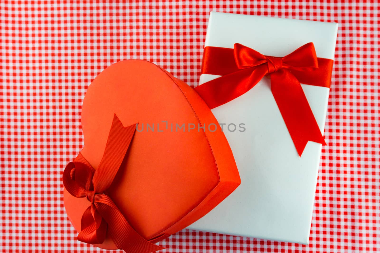 Valentines gift box with a red bow on red background Image of Va by nopparats