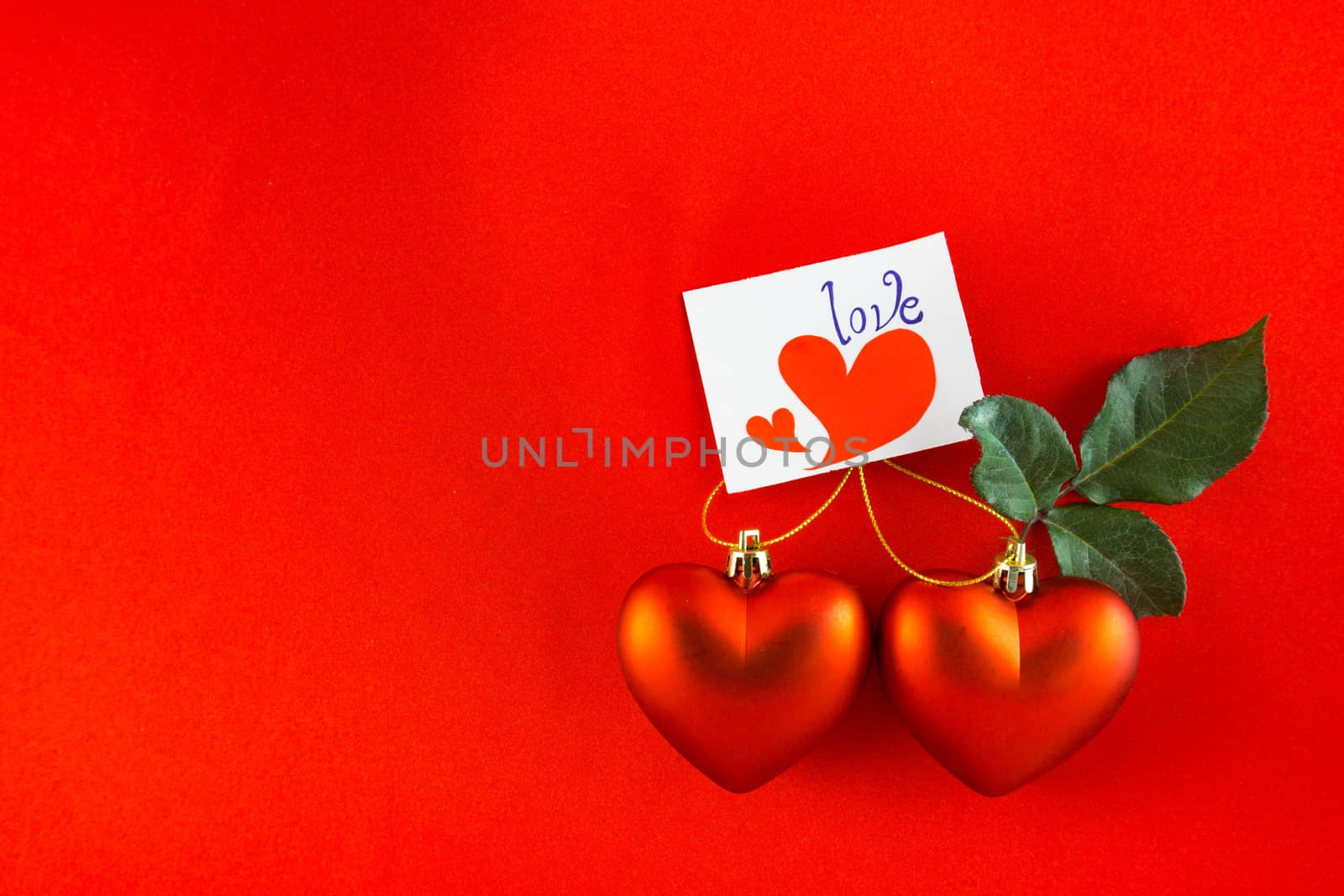 Red heart Valentines with message card on red background Image o by nopparats