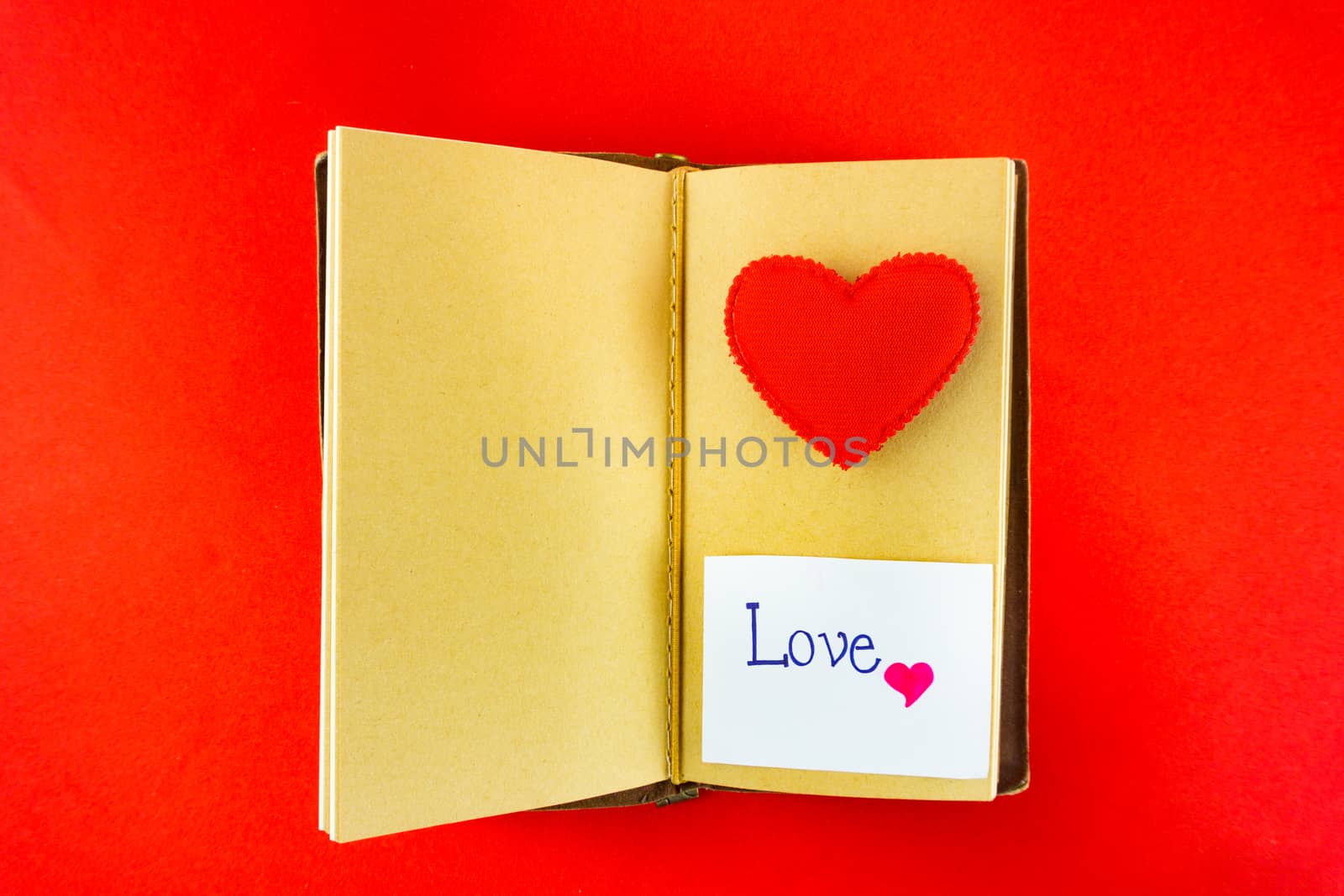 Valentines notebook with message card on red background Image of by nopparats