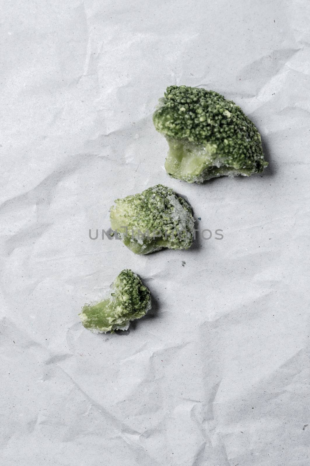 Macro close up shop of frozen broccoli veggies.