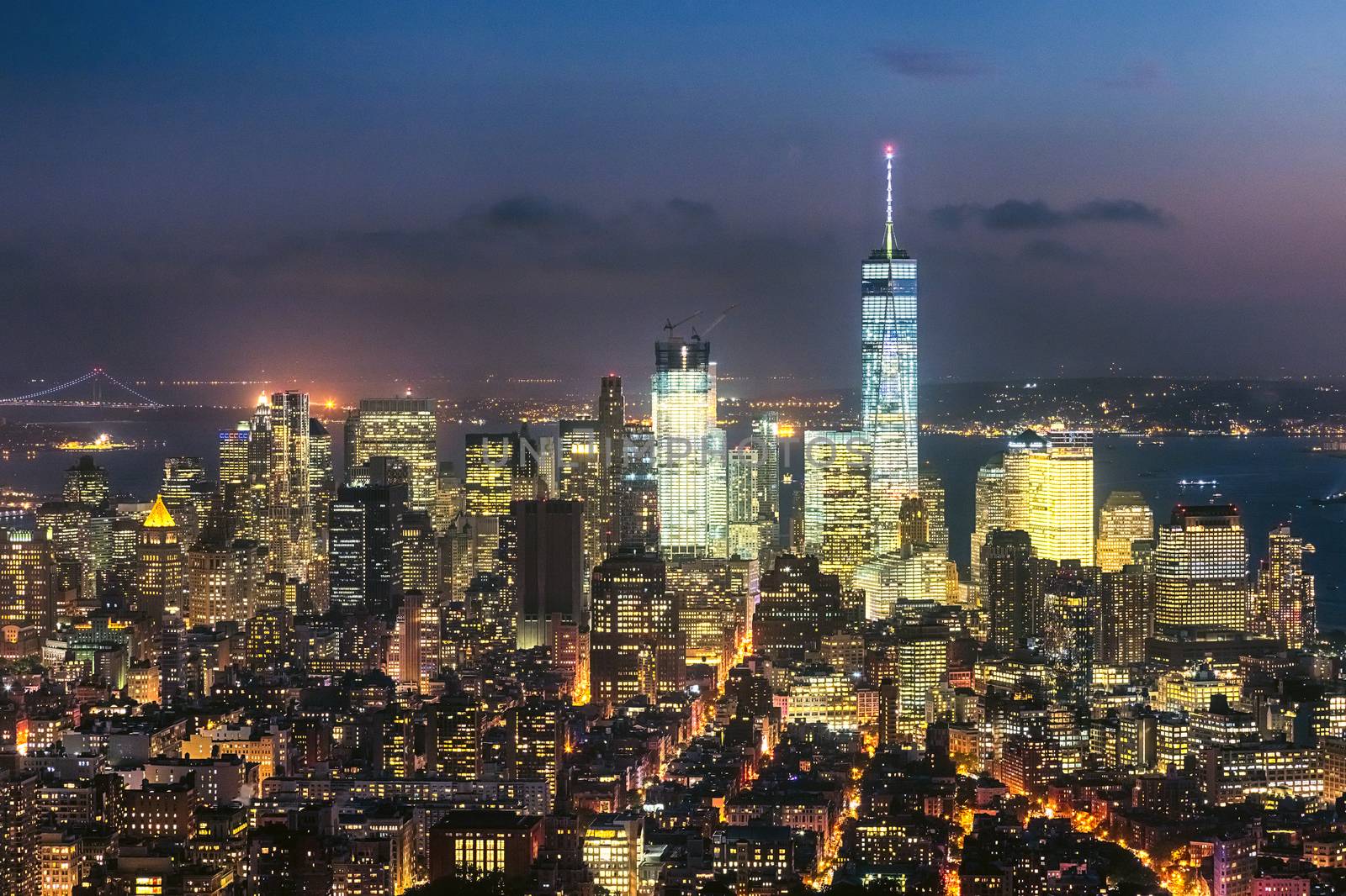 The New York City skyline in the night w the Freedom tower