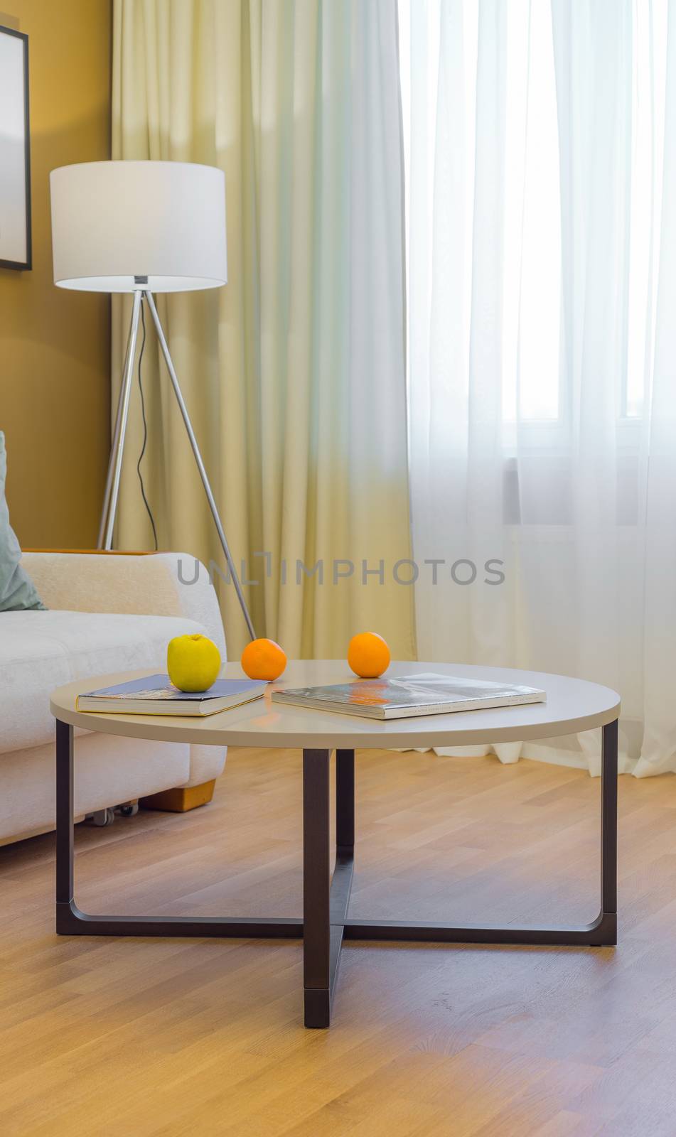 Journal table with oranges in the living  interior