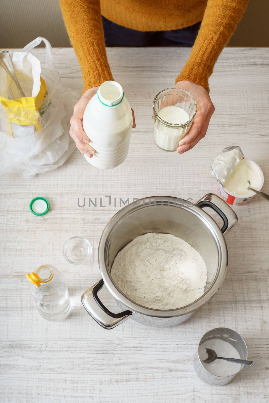 Ingredients for cooking dough pizza on the white table by Deniskarpenkov