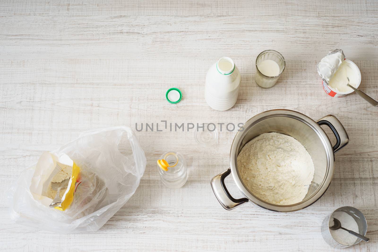 Ingredients for cooking dough pizza on the table by Deniskarpenkov