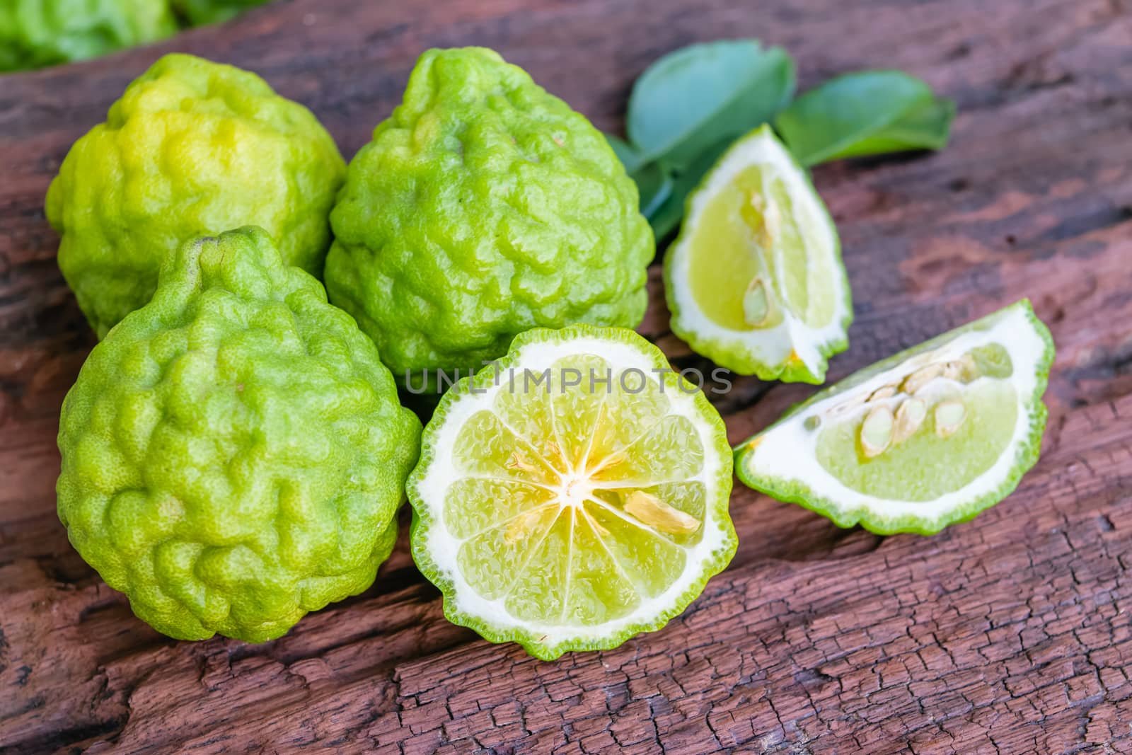 Bergamot on old wooden tables background.