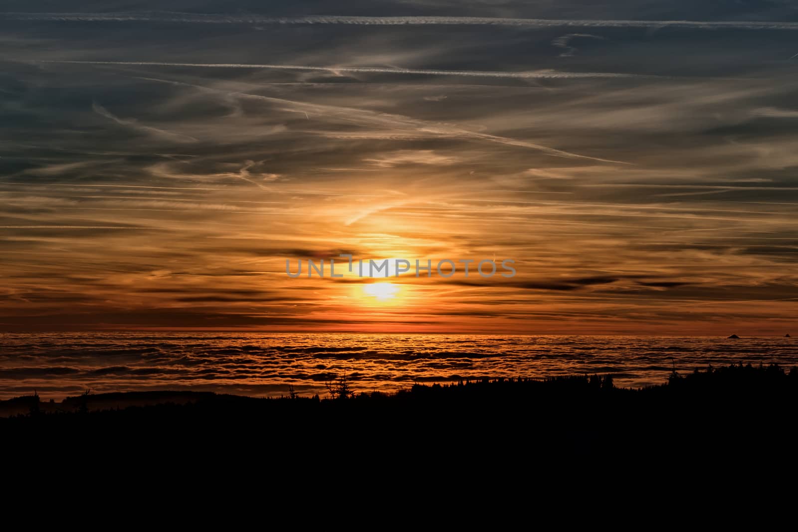 Amazing evening with sunset in Eagle mountains. Beautiful mountain within inversion