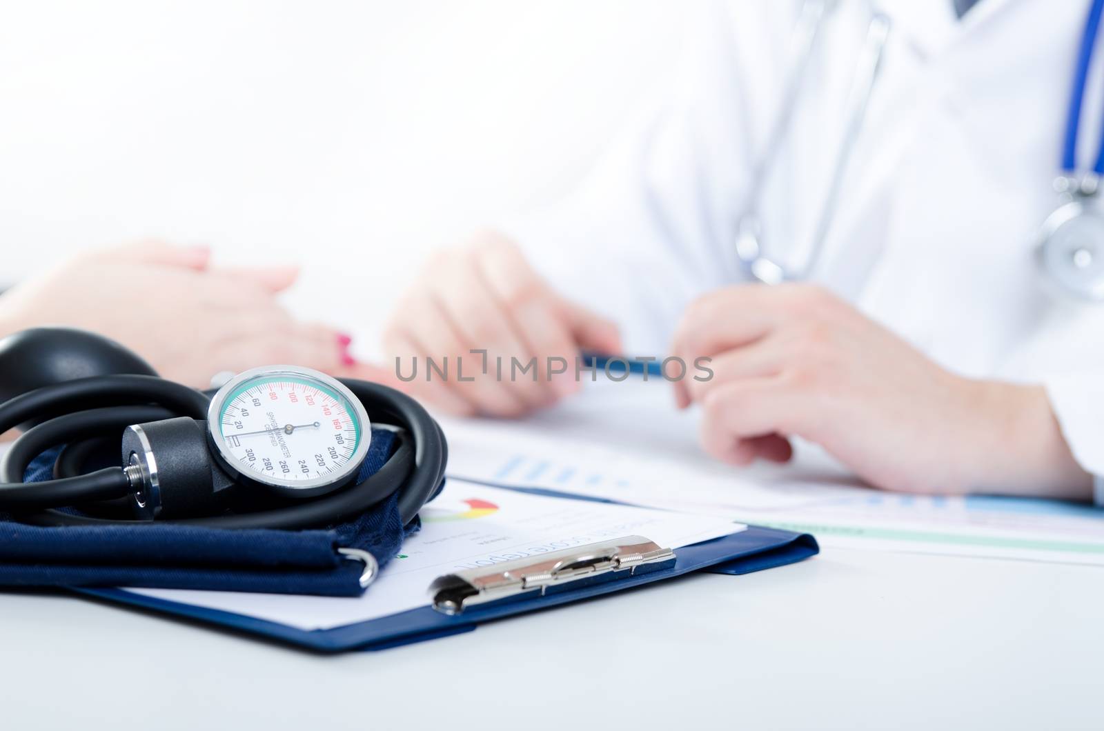 Doctor and patient medical consultation. doctor patient health care office desk stethoscope medical concept