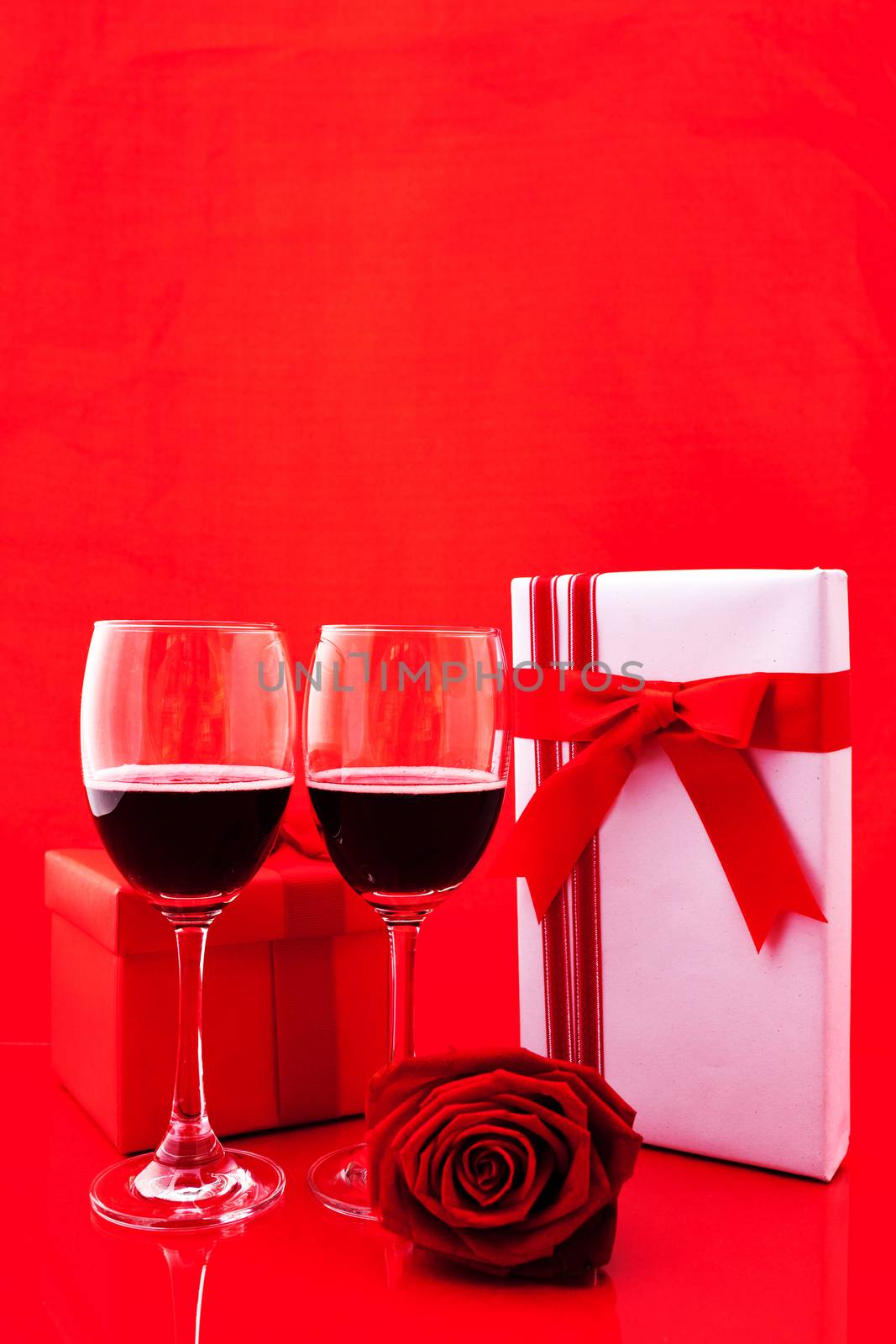 St Valentine's setting with present and red wine.