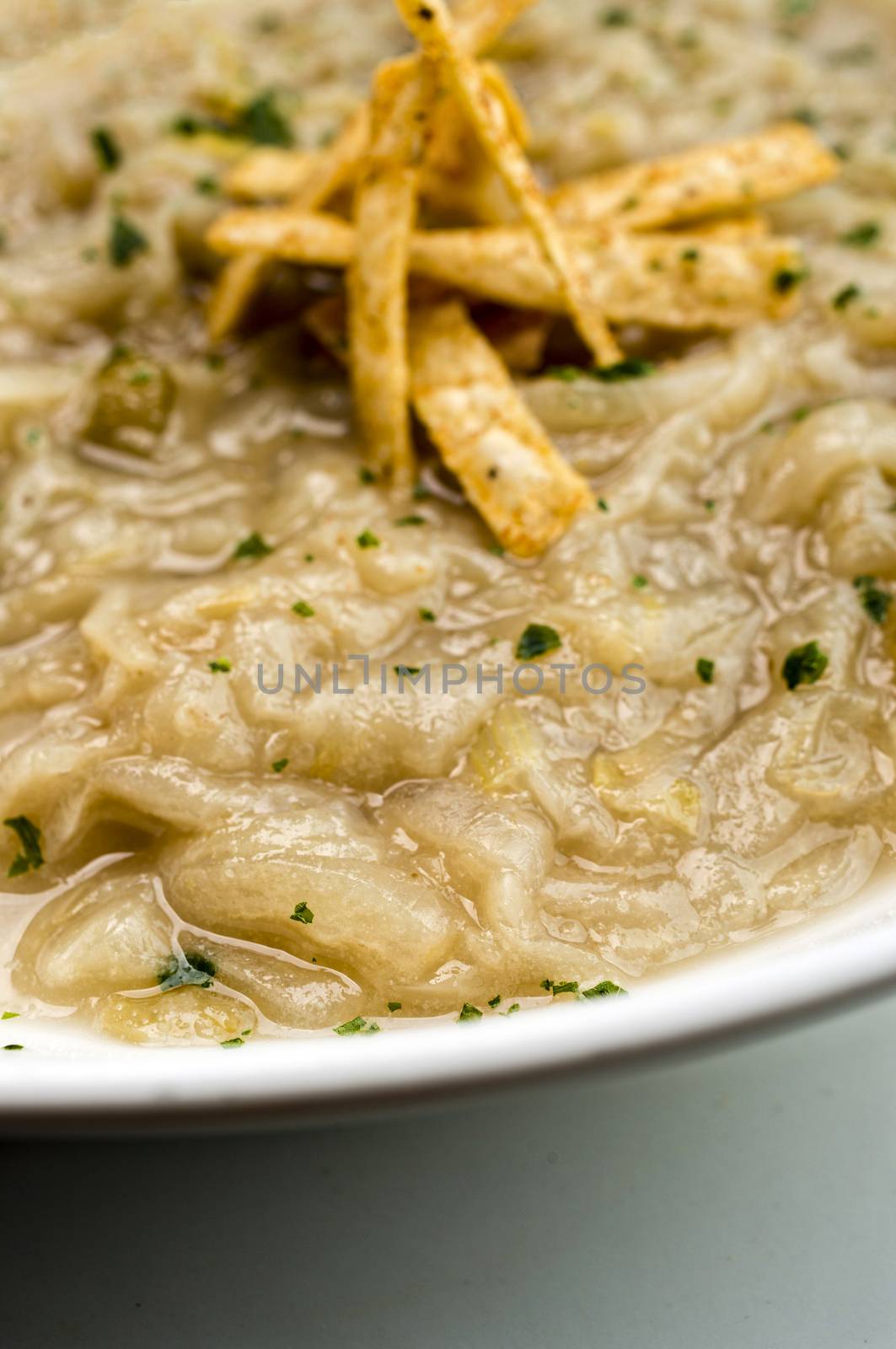 French onion soup with croutons in a white oval modern dish
