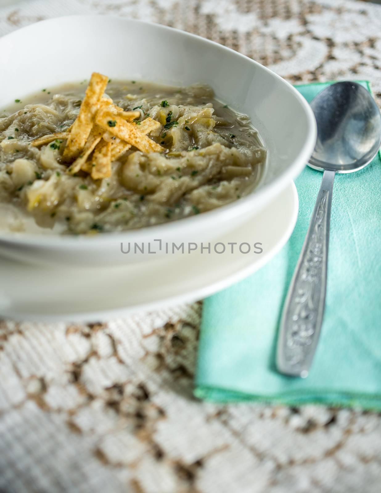 French onion soup with croutons in a white oval modern dish