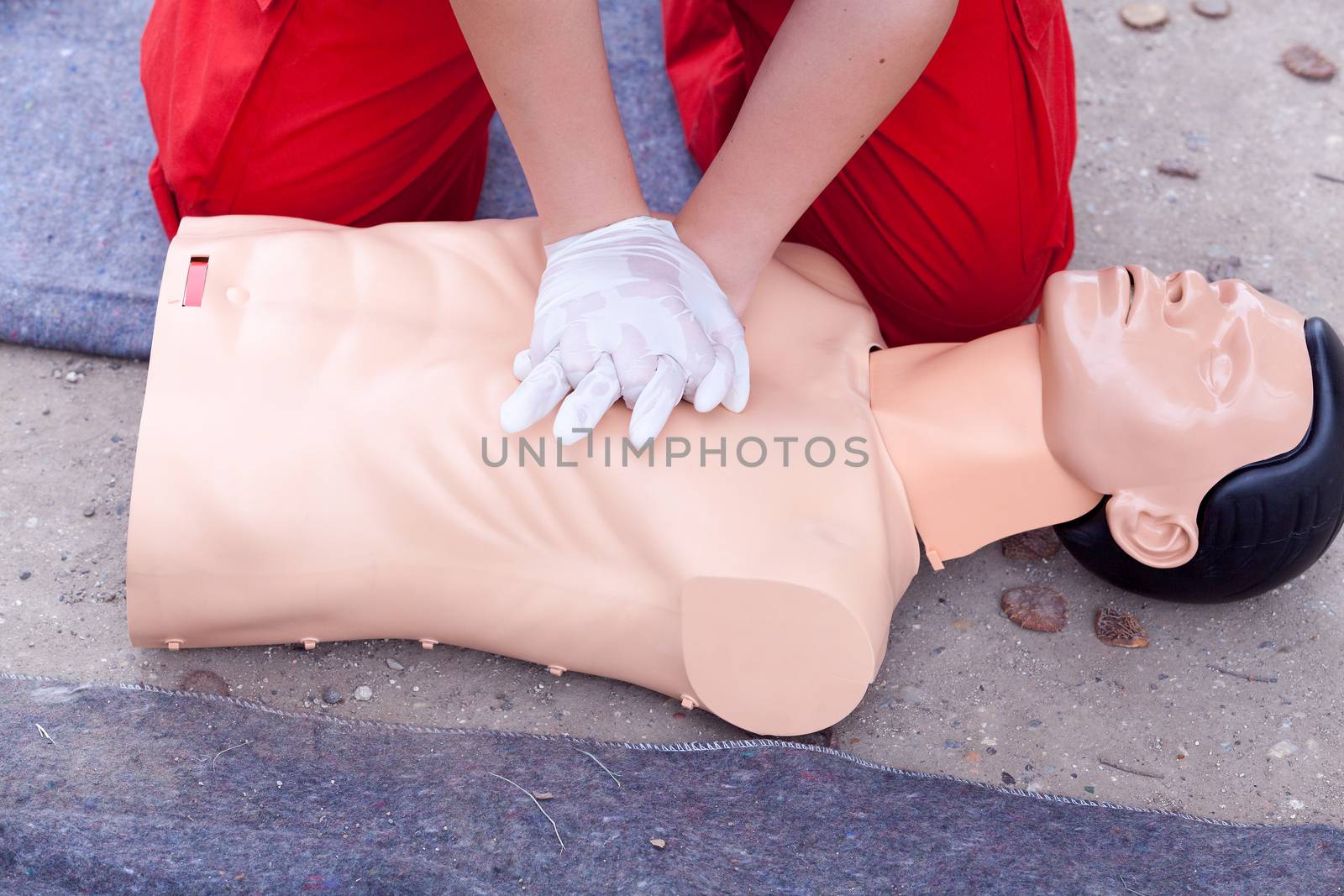 Rescuer practicing heart massage