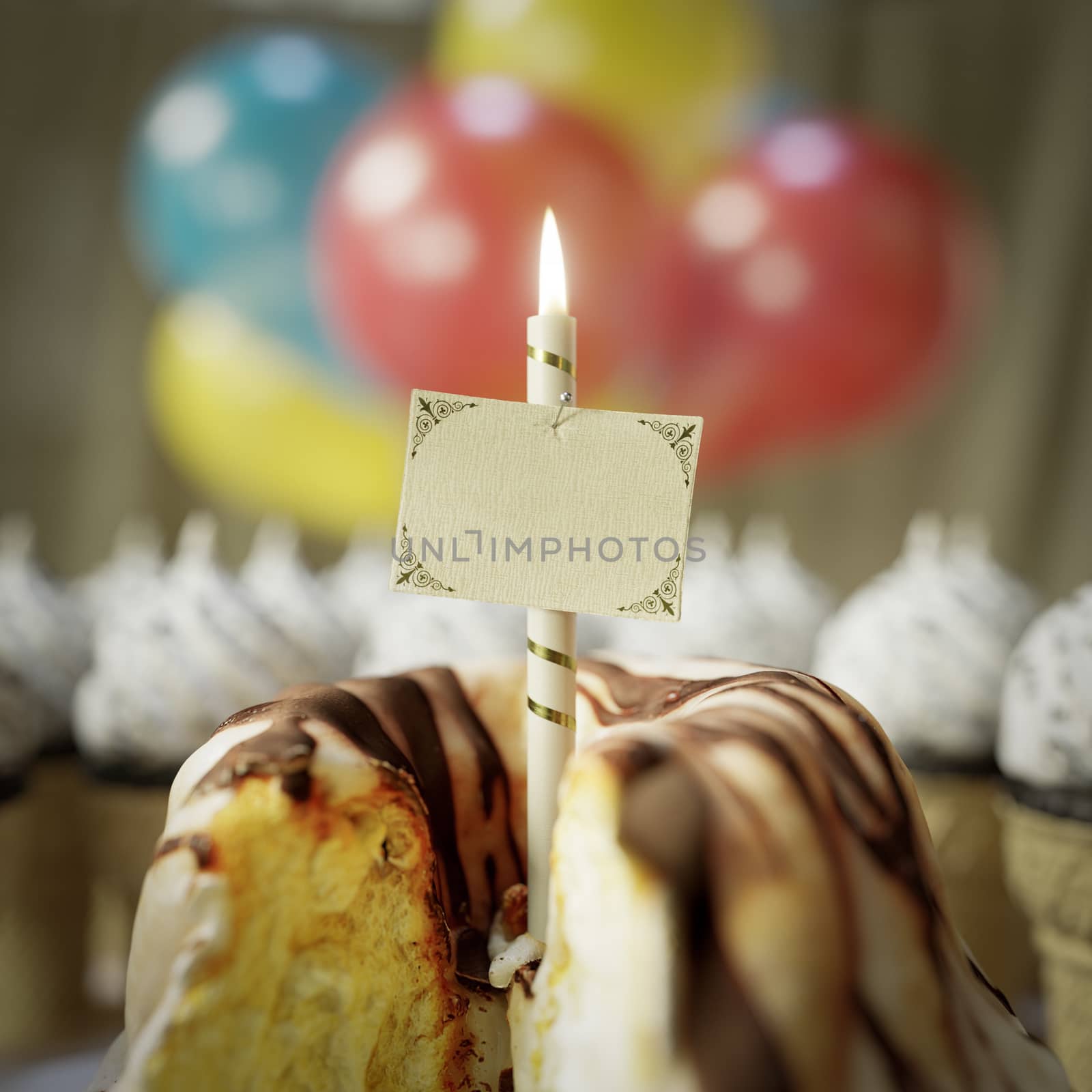 birthday cake with greeting card and candel conceptual close up photo