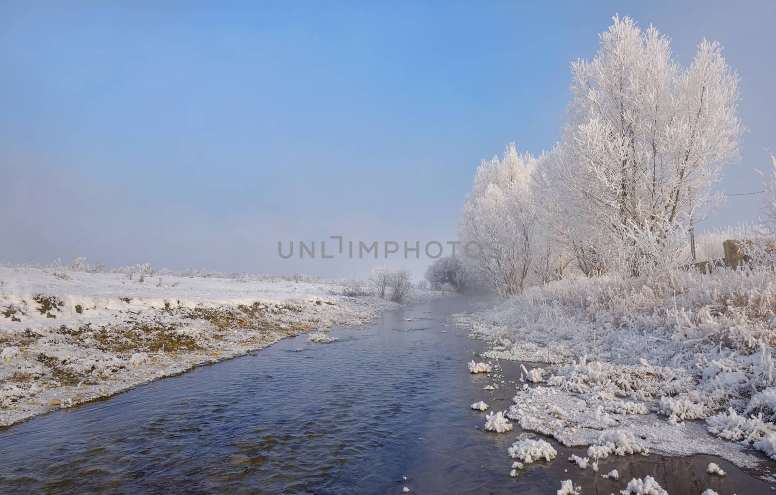 Winter river on a sunny day in Brasov, Romania
