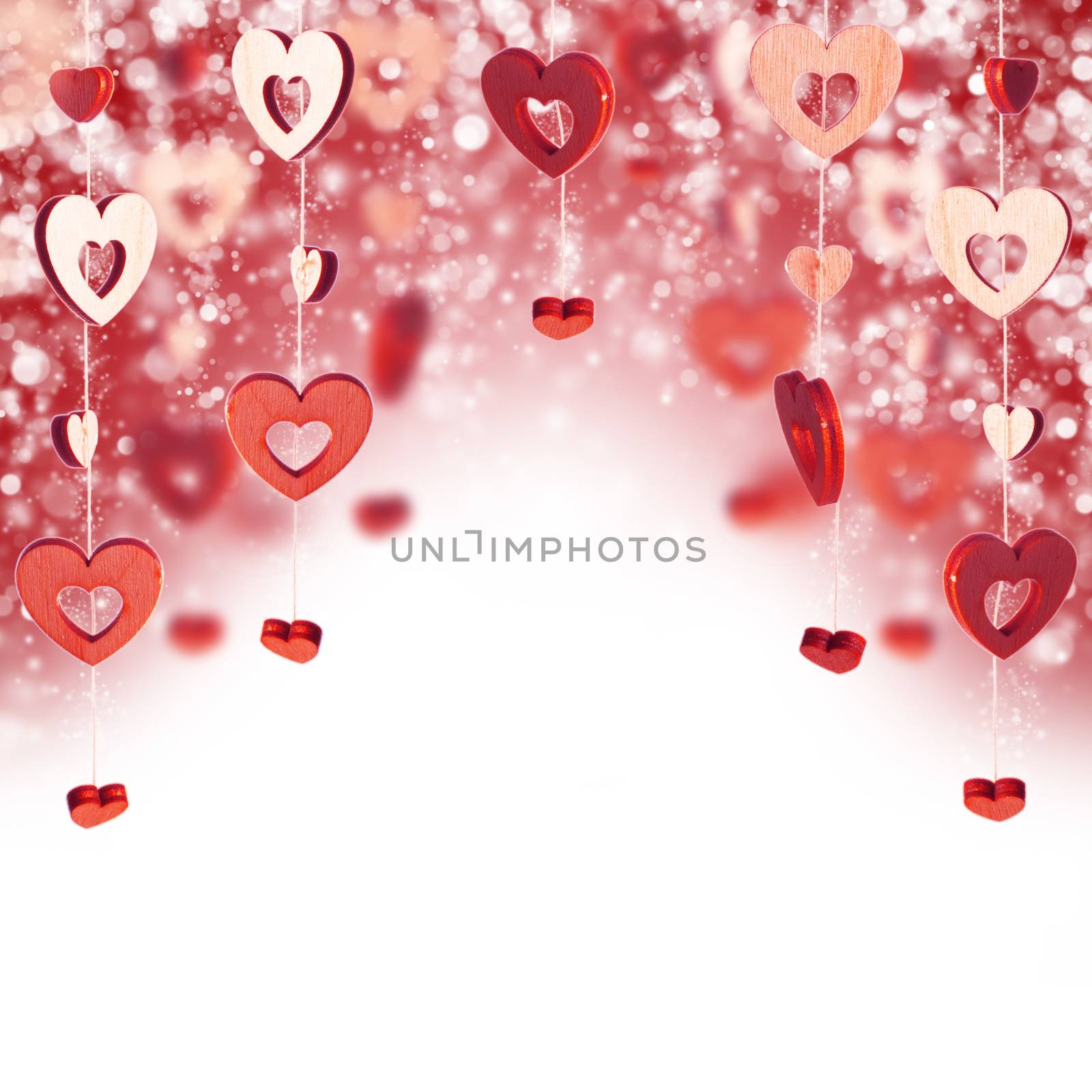 Red wooden decorative hearts and bokeh lights, Valentine day background