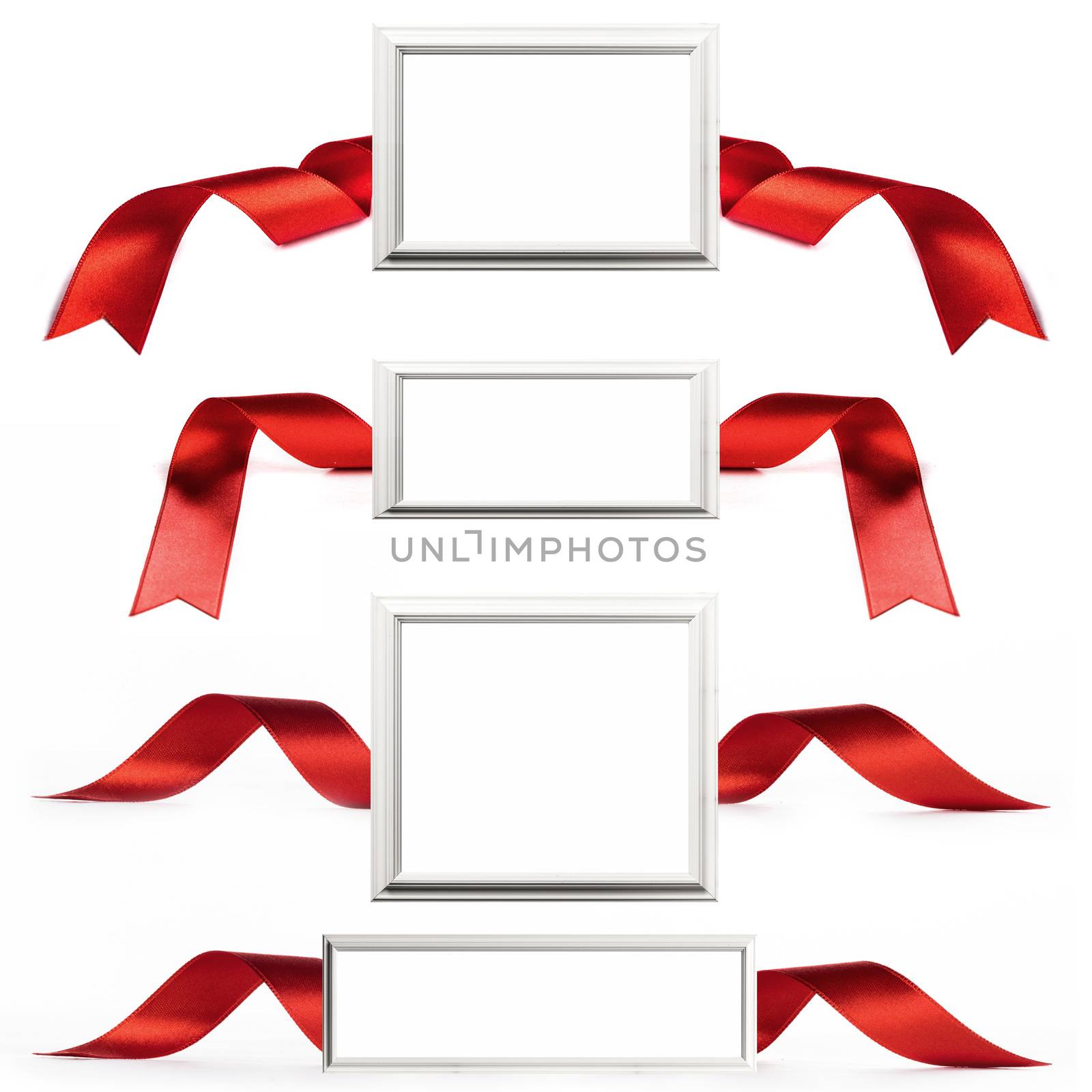 White wooden picture frame with copy space and satin ribbon set isolated on white background