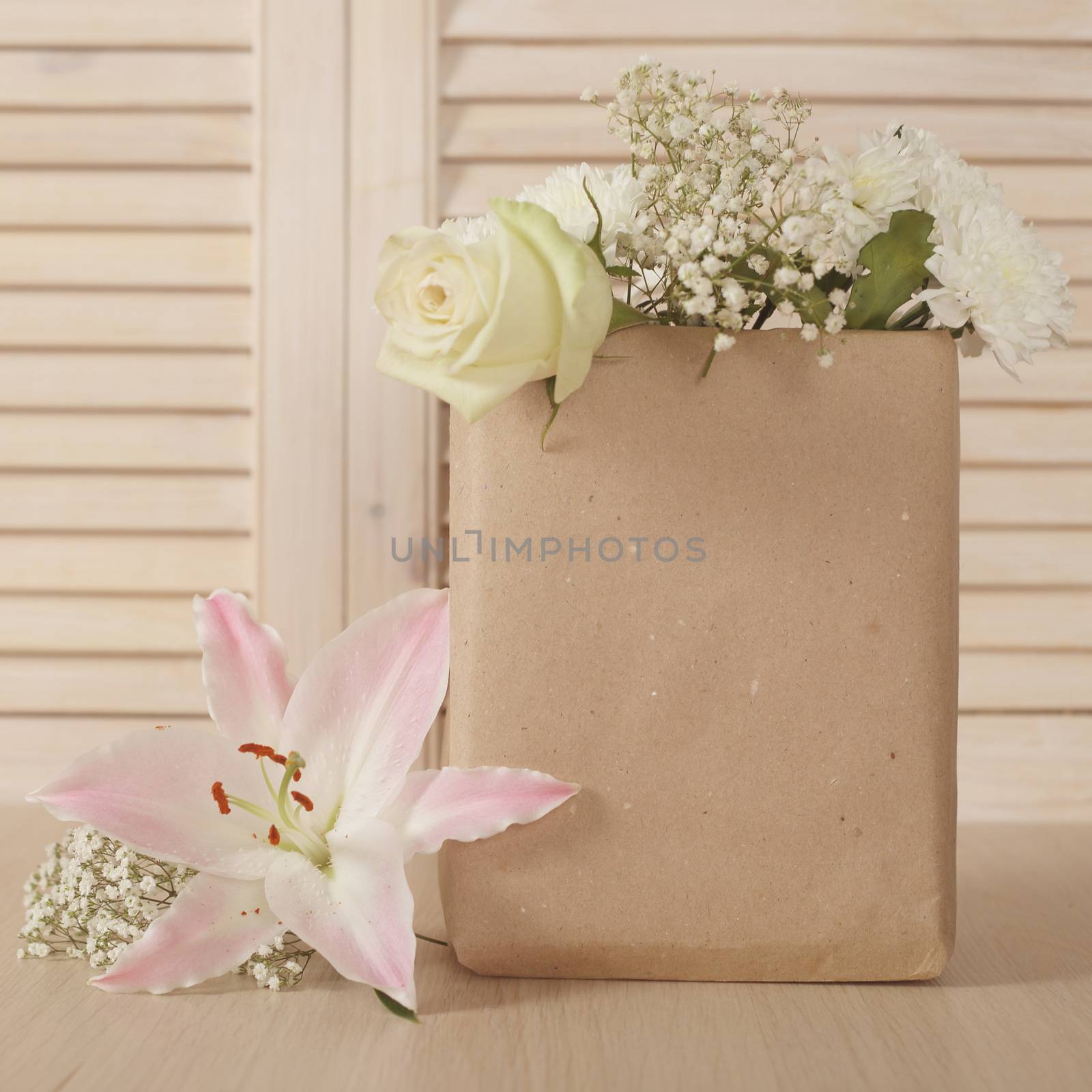 Valentine day bouquet of flowers in paper bag