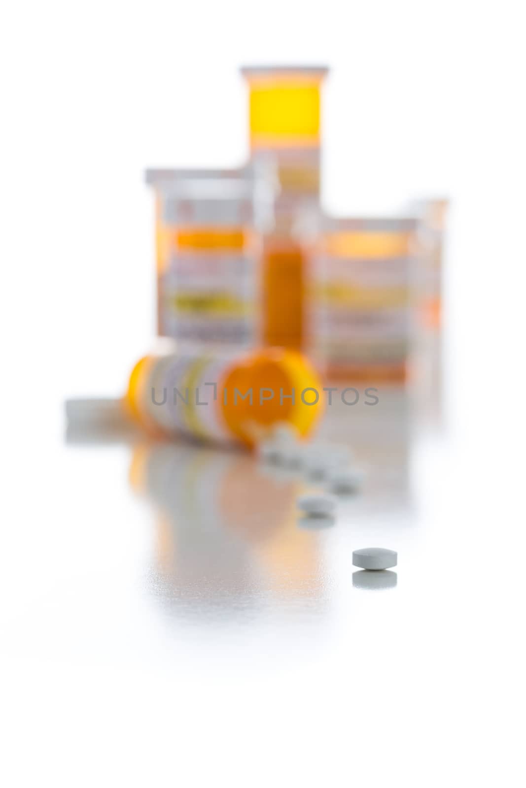 Non-Proprietary Medicine Prescription Bottles and Spilled Pills Isolated on a White Background.