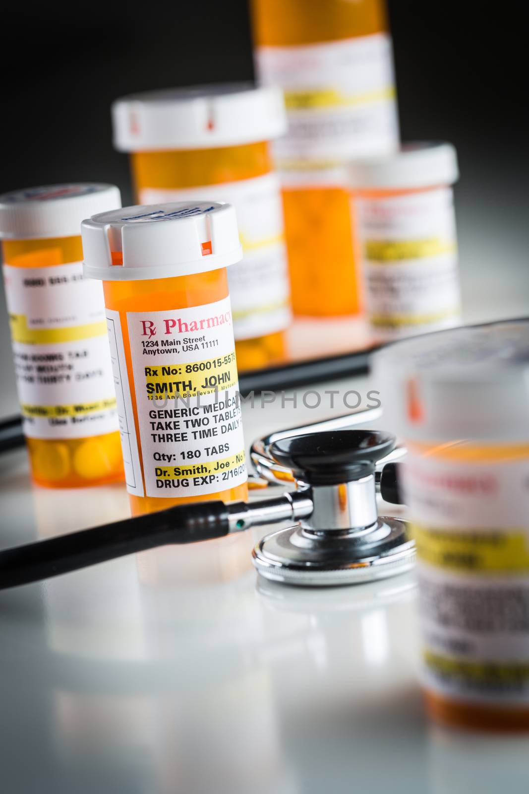 Several Non-Proprietary Medicine Prescription Bottles Abstract with Stethoscope.