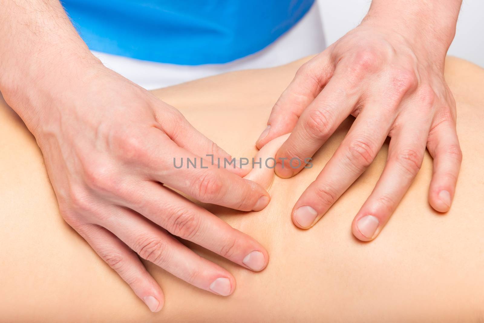 male masseur hands massaging the skin close-up