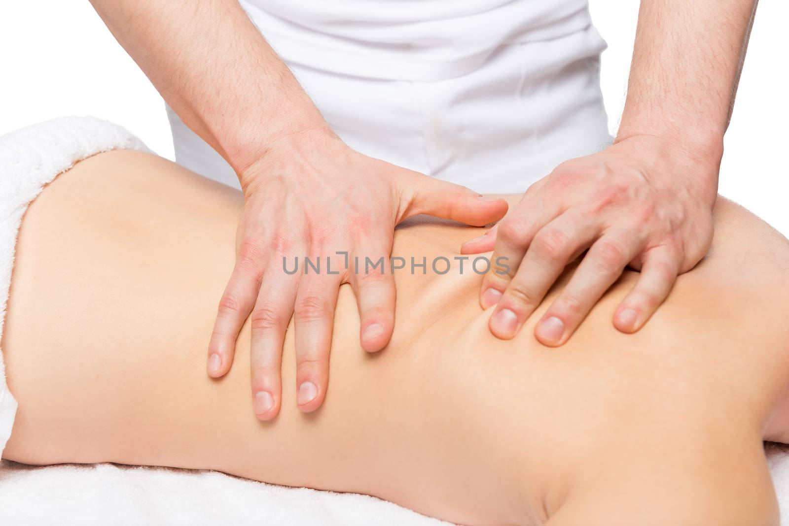 male masseur does back massage on a massage table