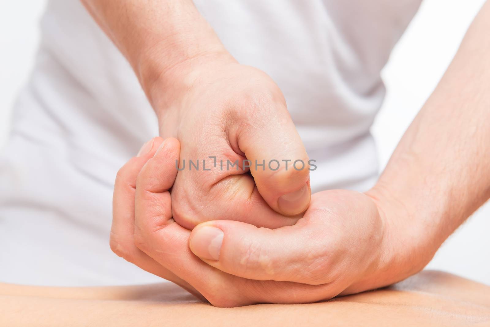 process of the sports massage, man's hand close-up