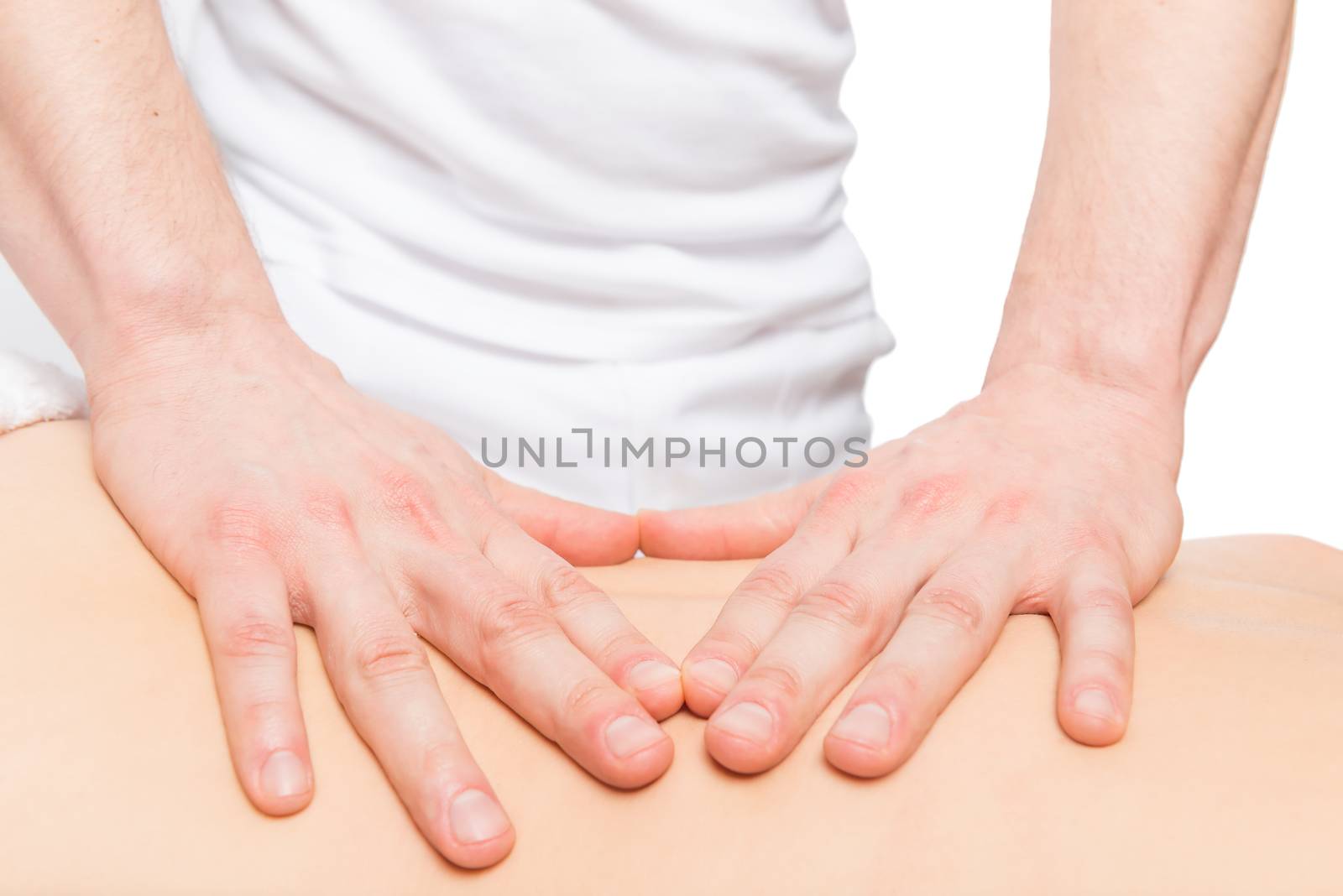 masseur fingers on the back of a young girl patient