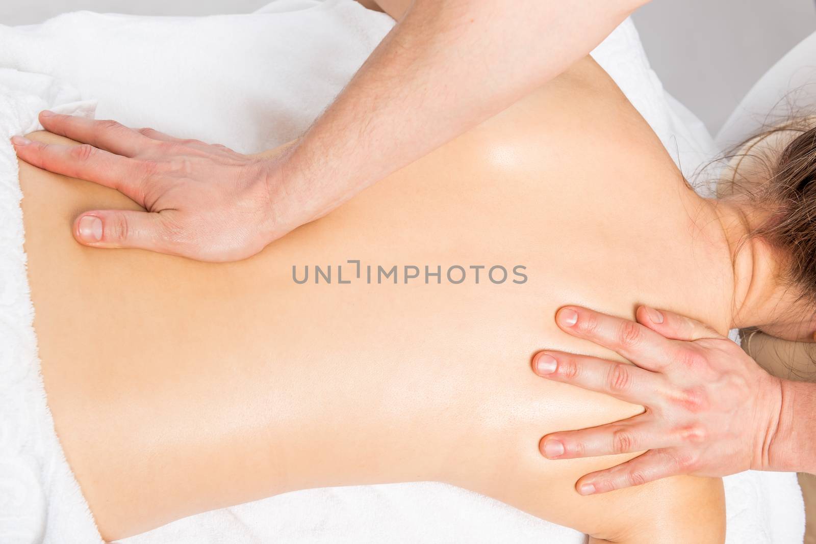 massage technique stretching back women in the salon