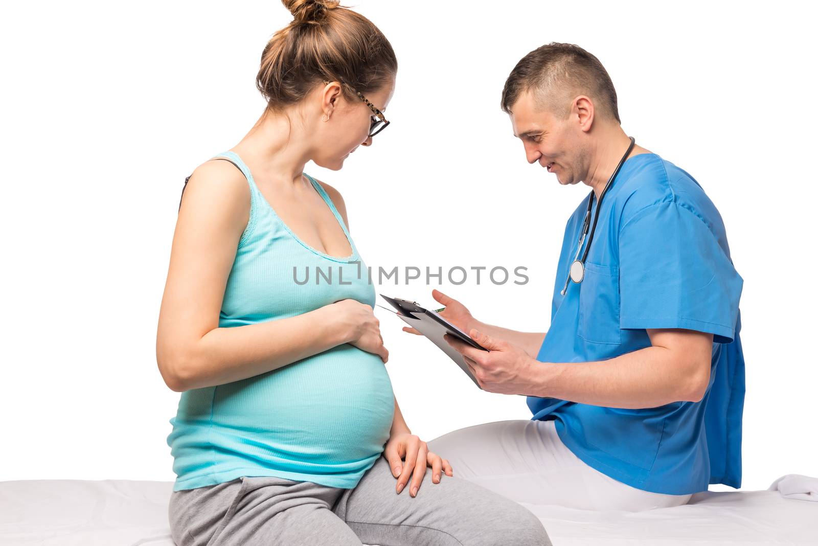 Healthy pregnant woman at examination in doctor-gynecologist