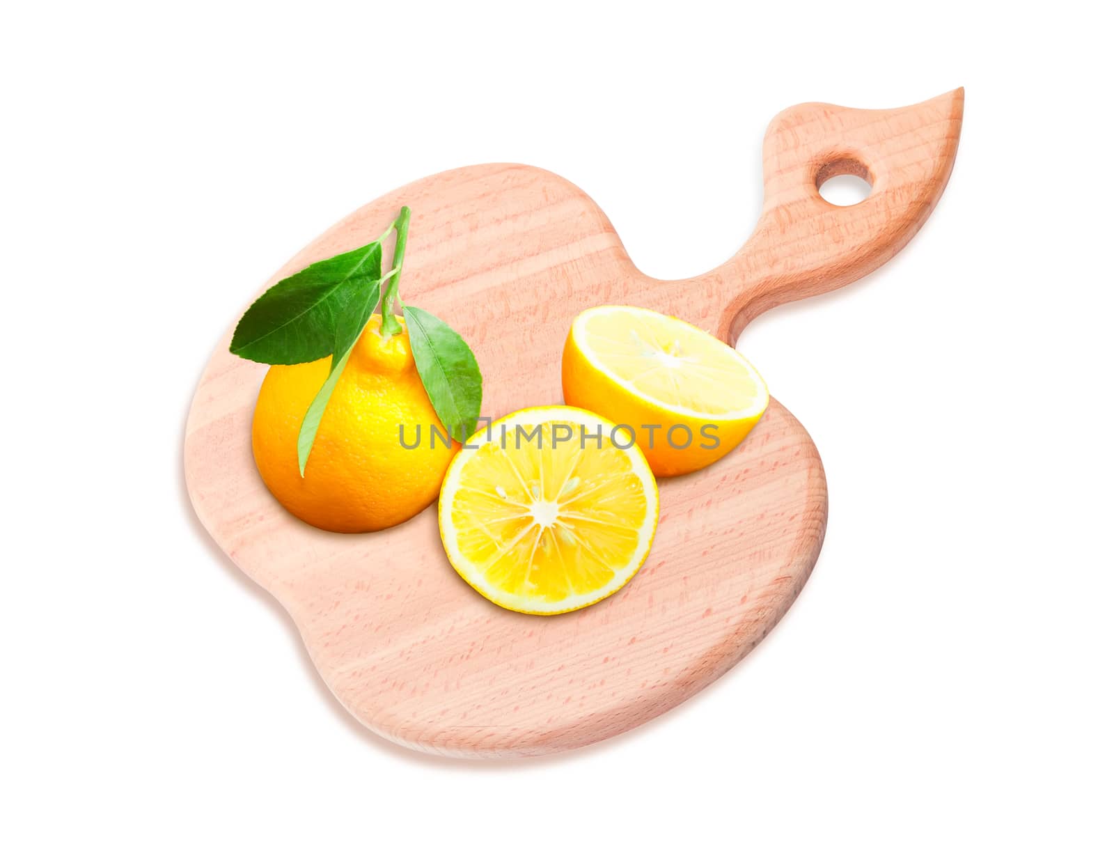 Two lemons on a chopping board on a light background by anmbph