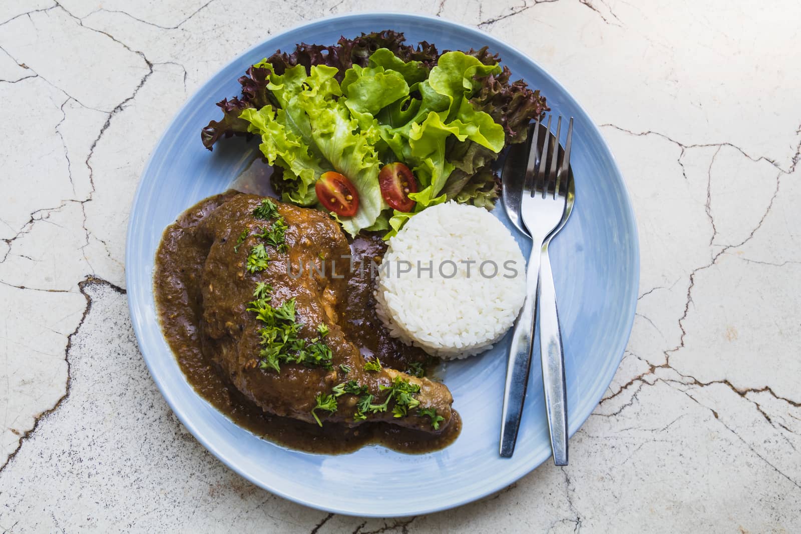 roasted chicken leg with rice and vegetable