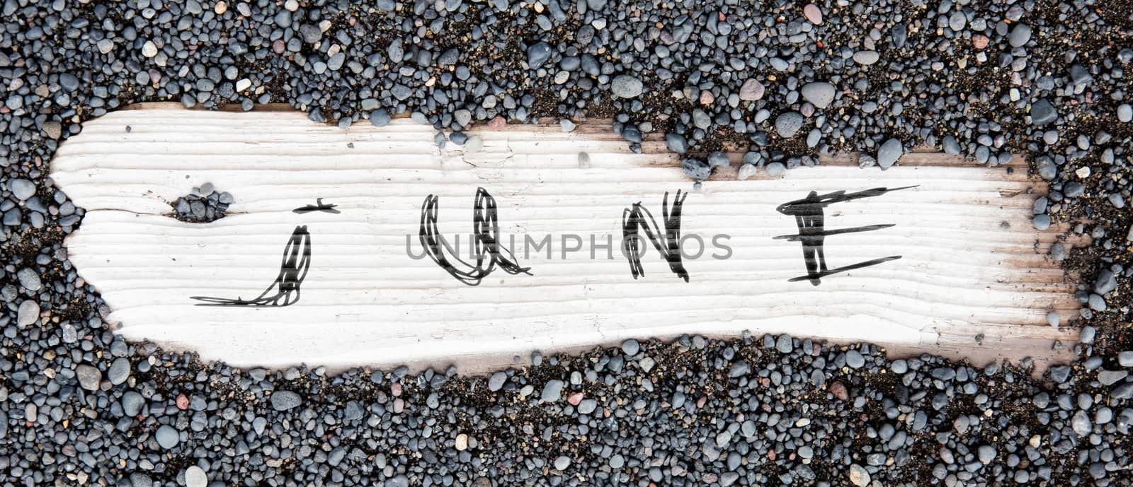 Sand on planked wood, black Icelandic sand - June