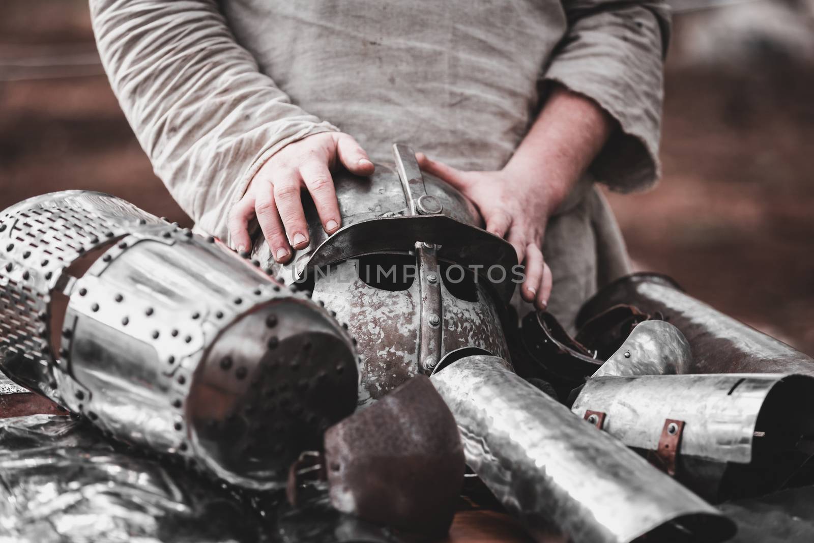 medieval knight armor and man's hand close-up