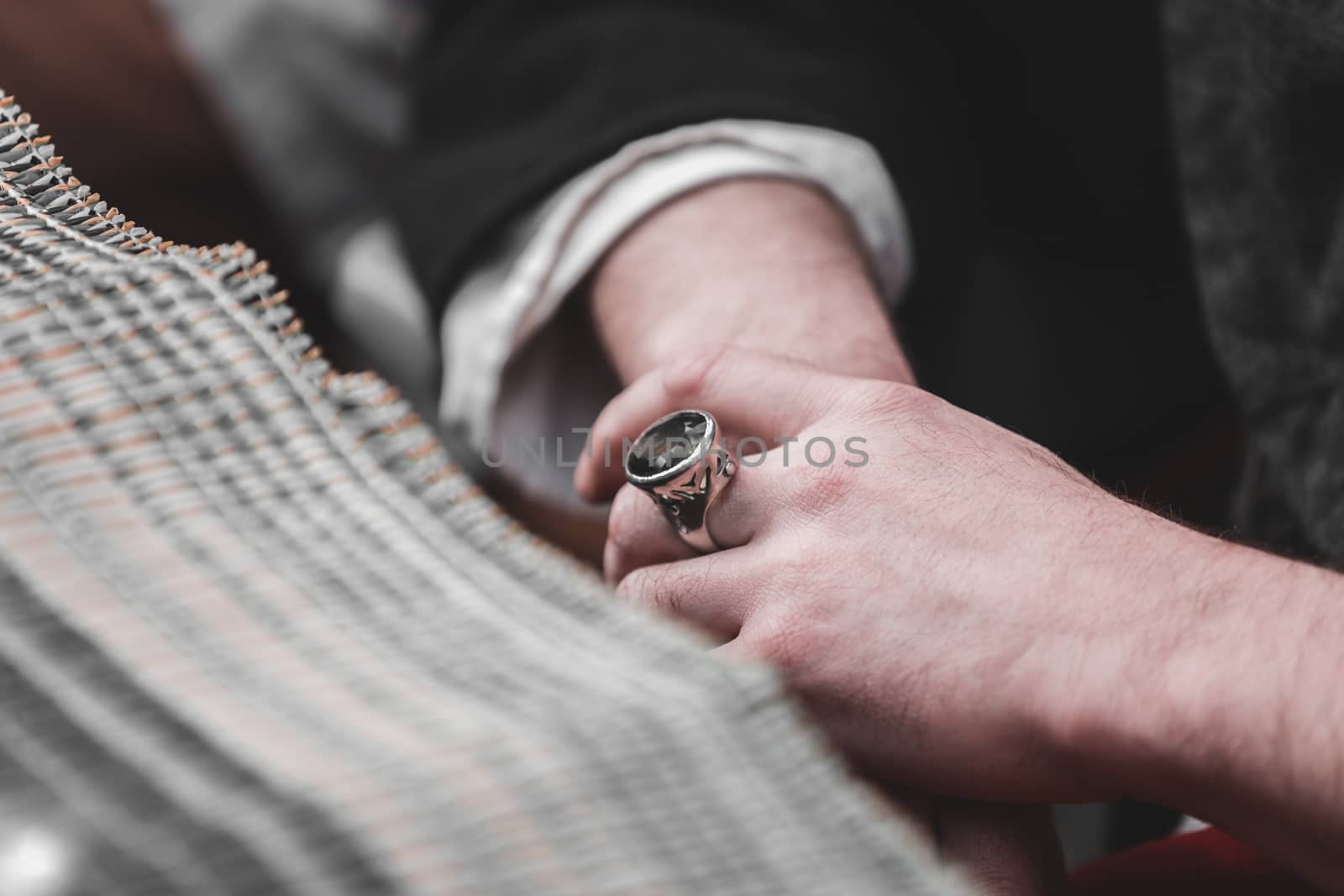 male hands closeup on finger vintage ring