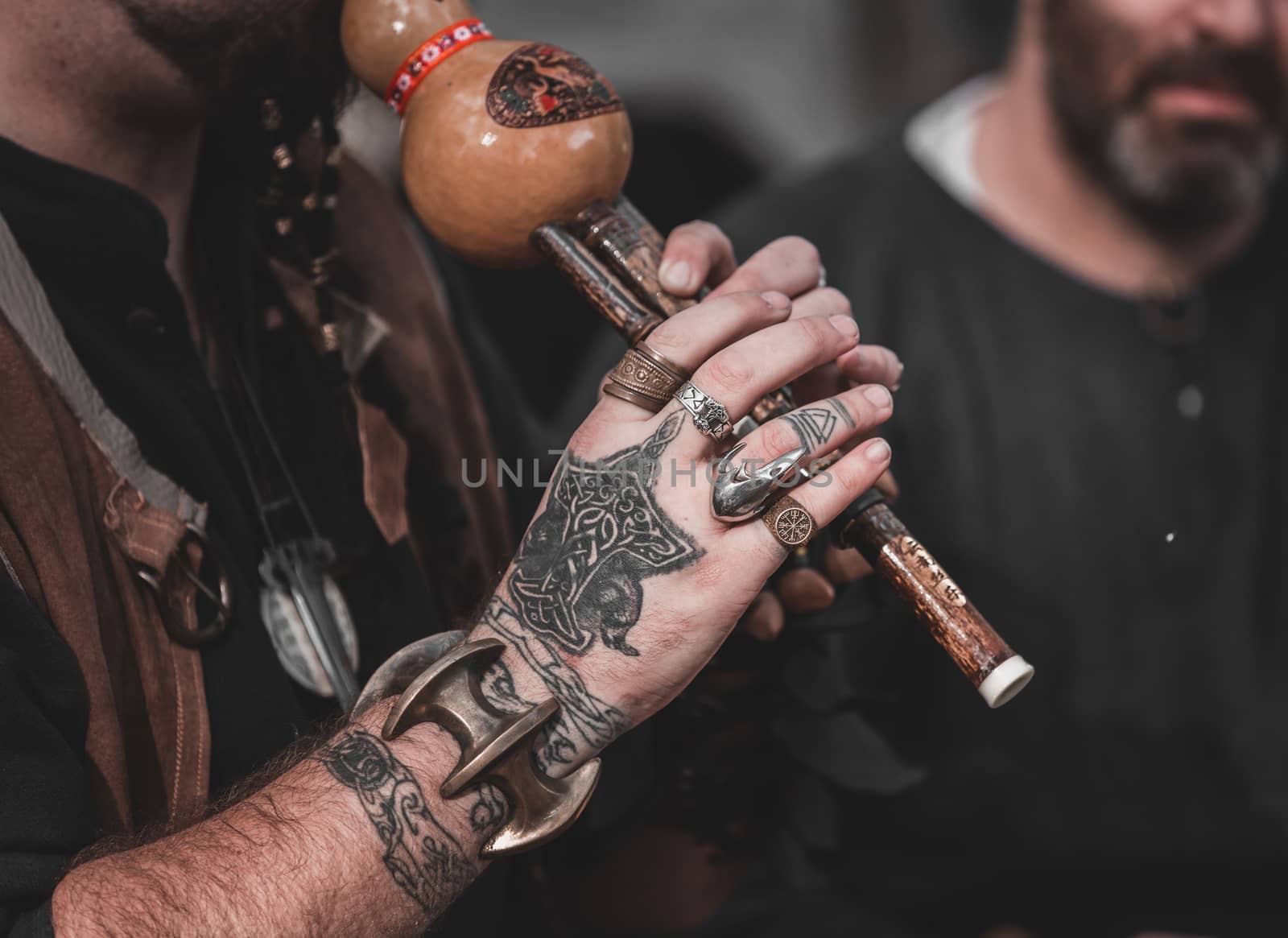 NATIONAL TRAIL, ISRAEL - December 17, 2016: man with tattooed hands playing a musical instrument