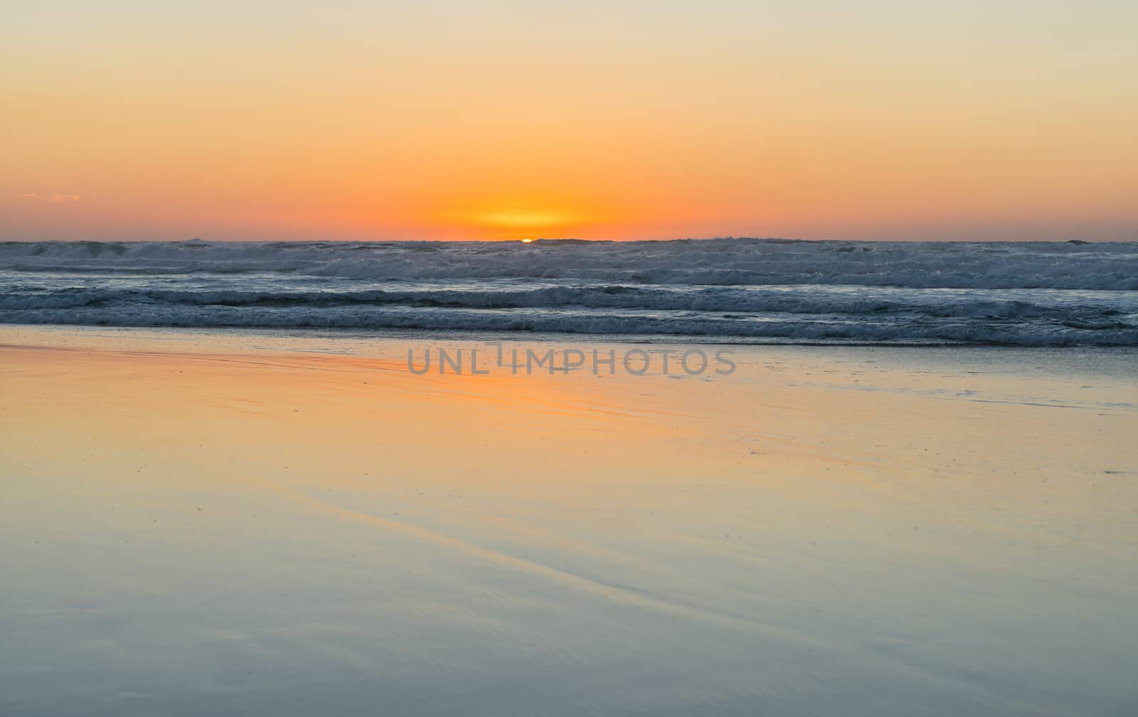 the landscape sea waves on sunset background