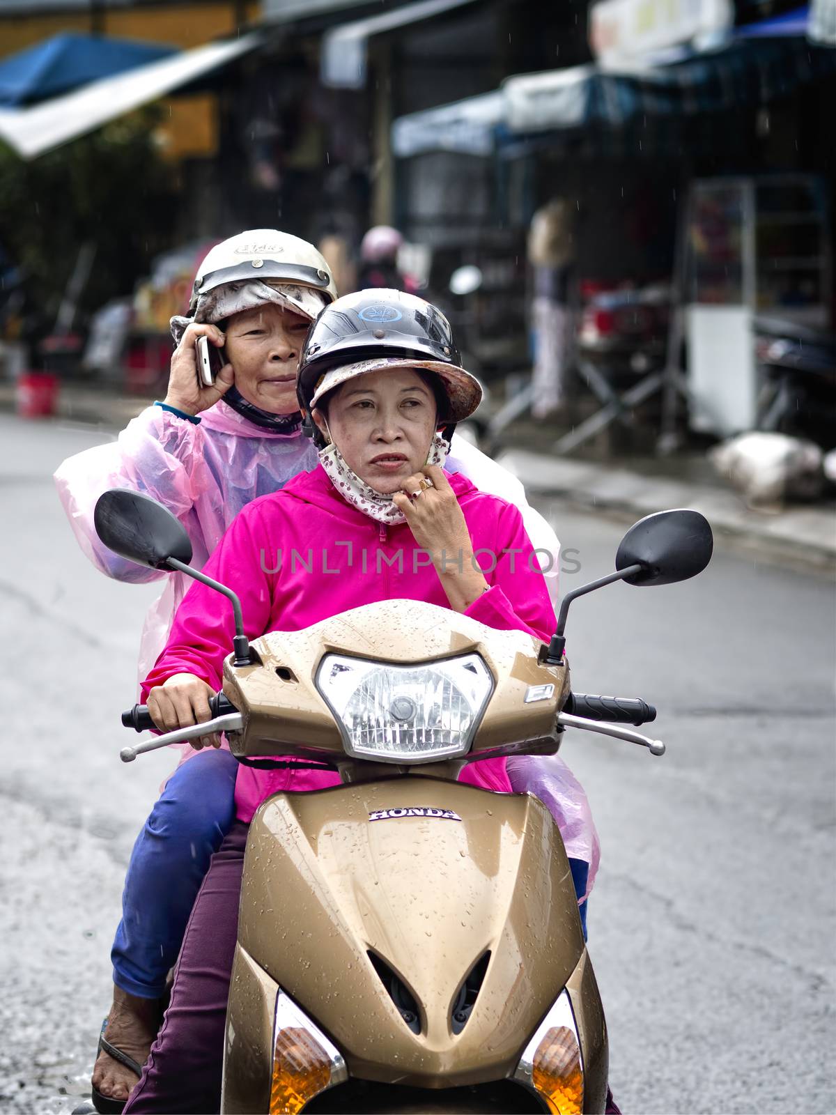 Funny biker with pillion in Hoi An by zkruger