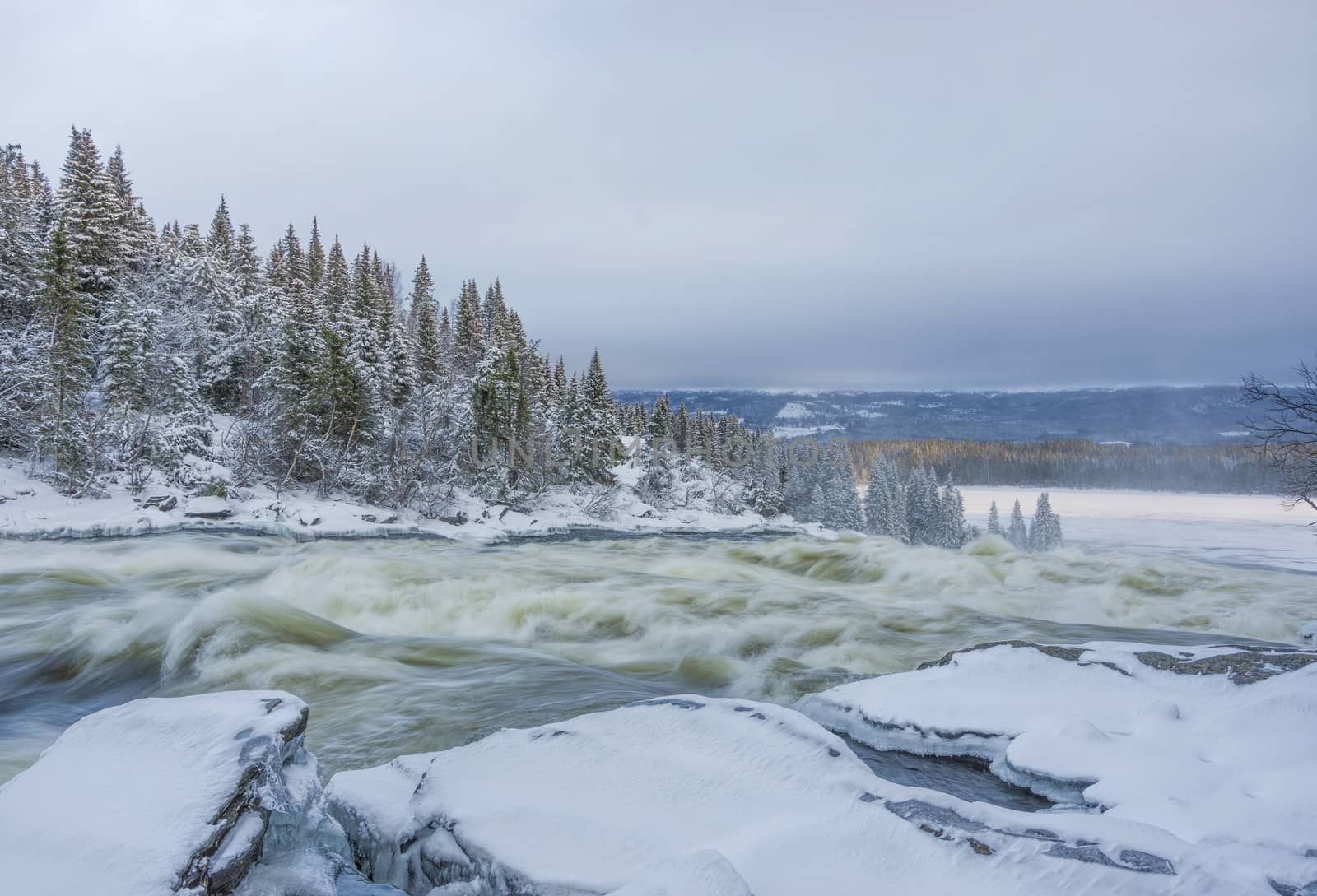 Tannoforsen waterfall in Sweden in winter by vizland