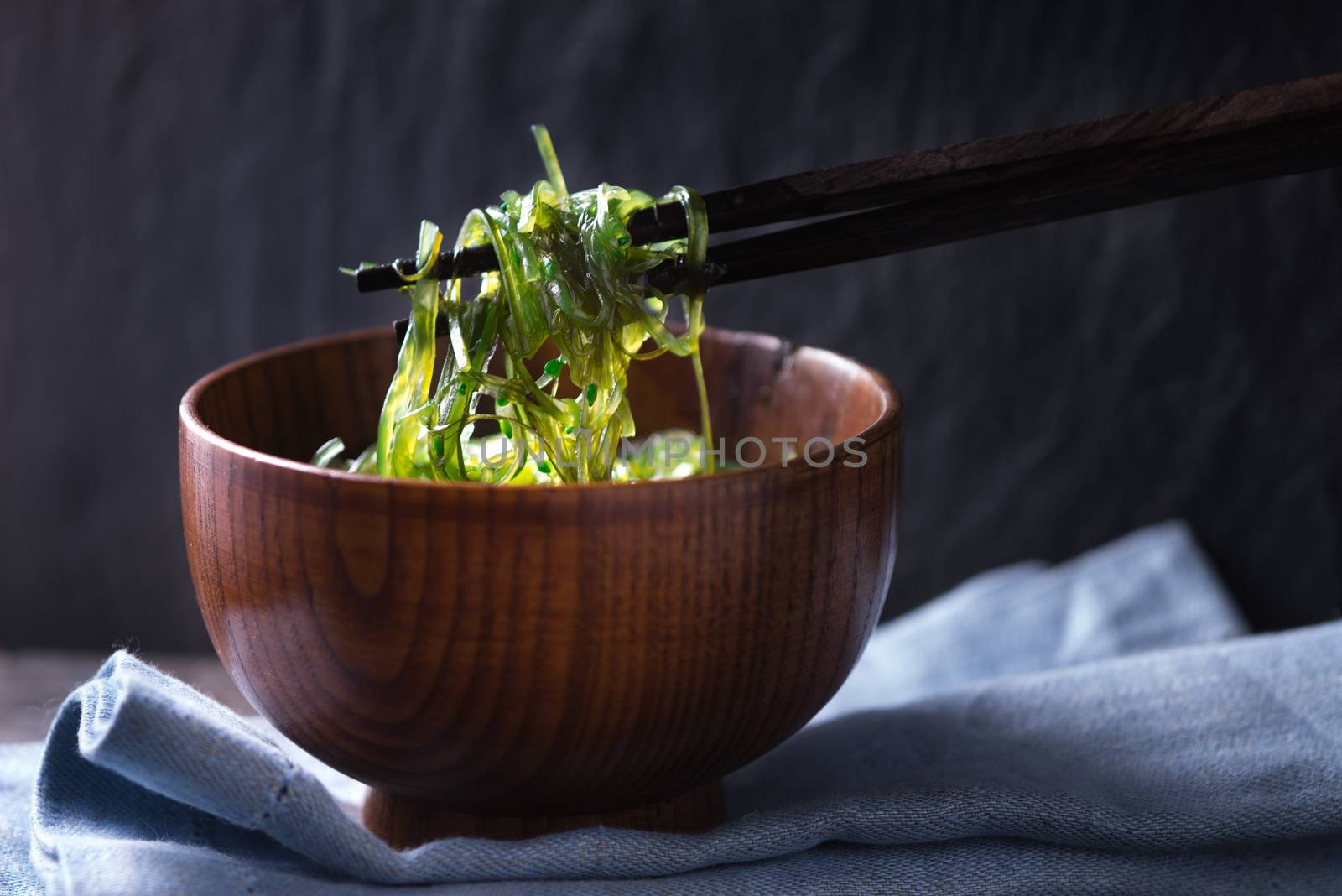 Chinese chopsticks with chuka salad horizontal by Deniskarpenkov