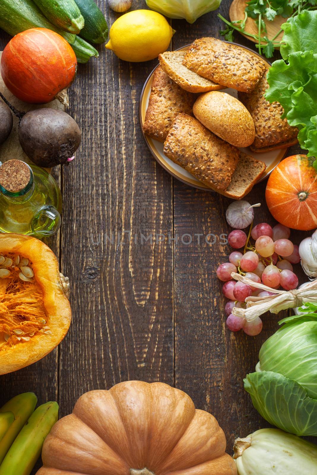Frame of  different vegetable and grain bread on the wooden table
