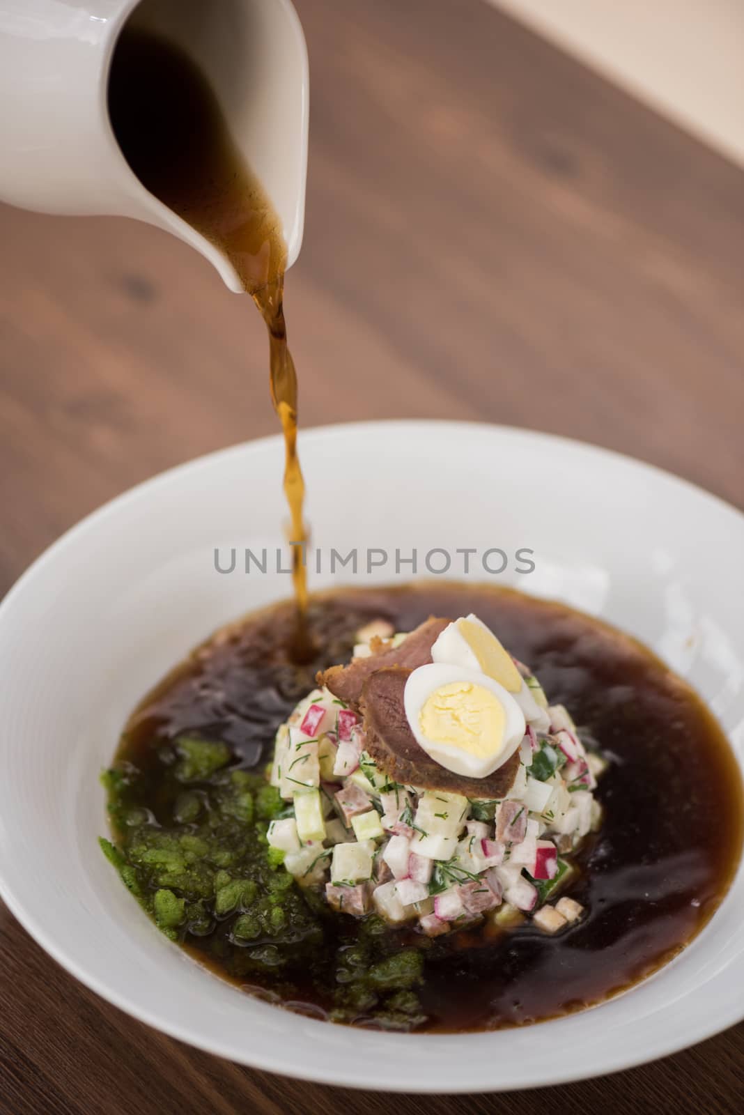 Traditional Russian kvass soup with vegetables - okroshka