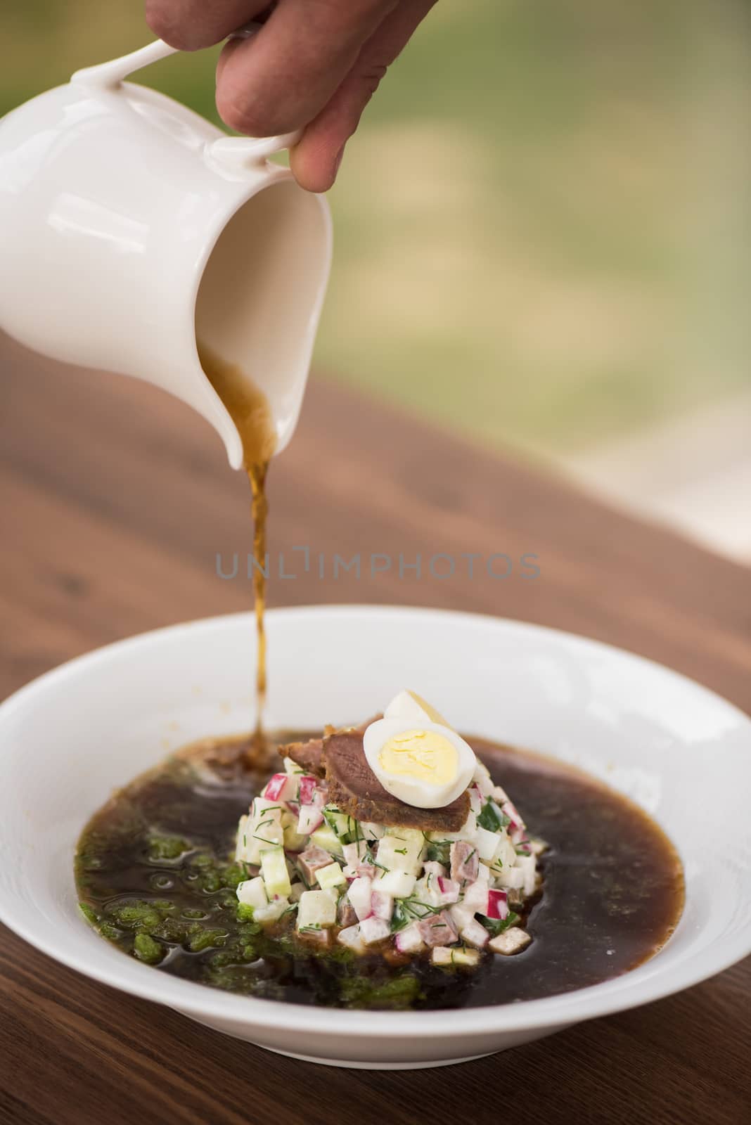 Traditional Russian kvass soup with vegetables - okroshka