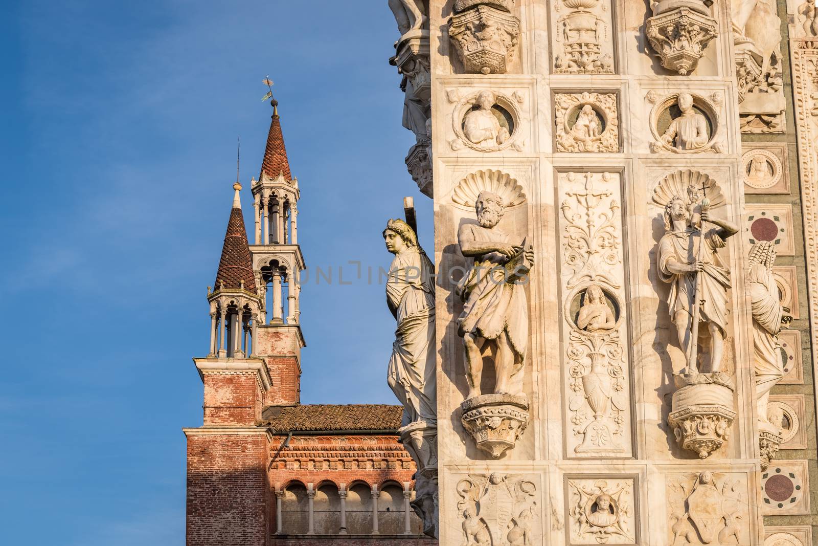 Awesome marble statues from the Renaissance period of the Pavia Carthusian monastery at sunset,Italy.