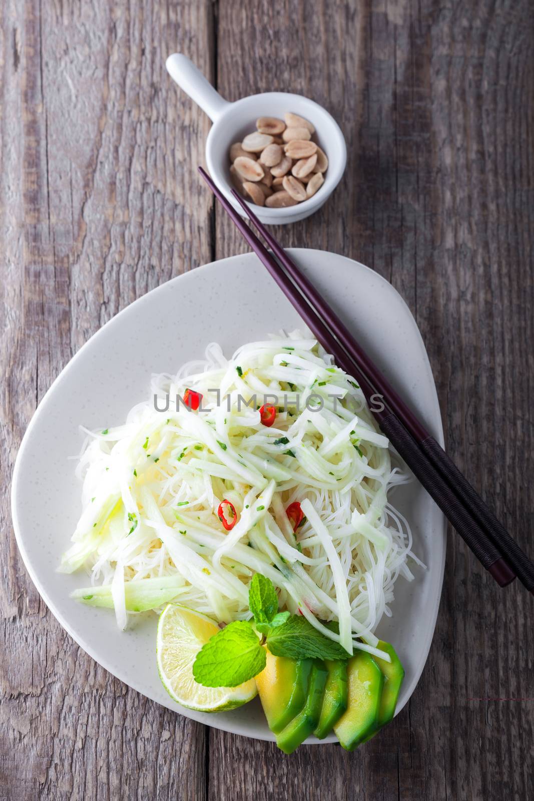 Spicy kohlrabi noodles, dressing: fish sauce, vinegar rices, lime garlic and ginger