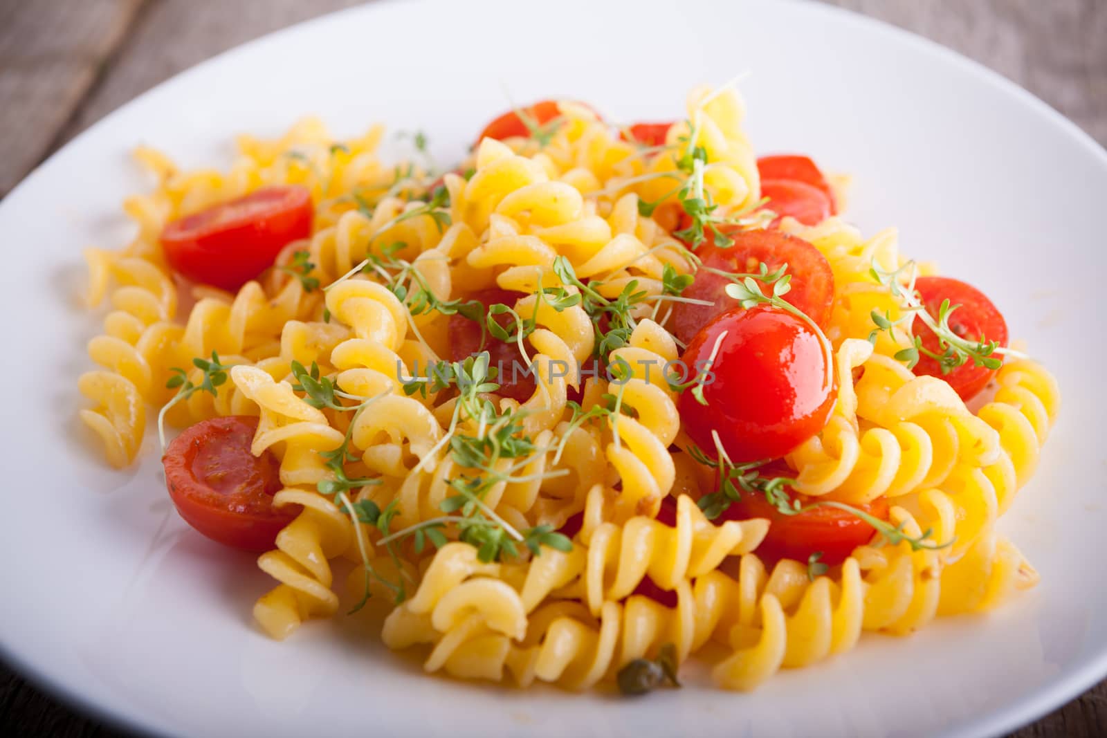 Fussili pasta with watercress and cherry tomatoes