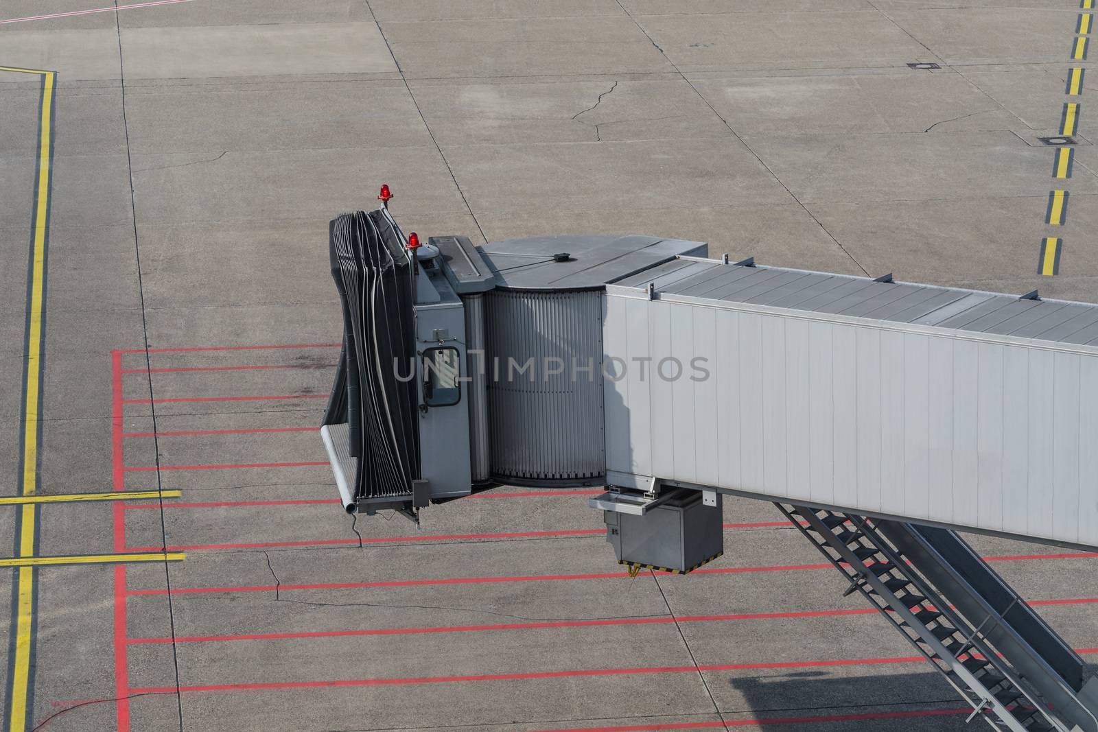 Airplane bridge, footpath in the airport for passengers entering or leaving the plane.