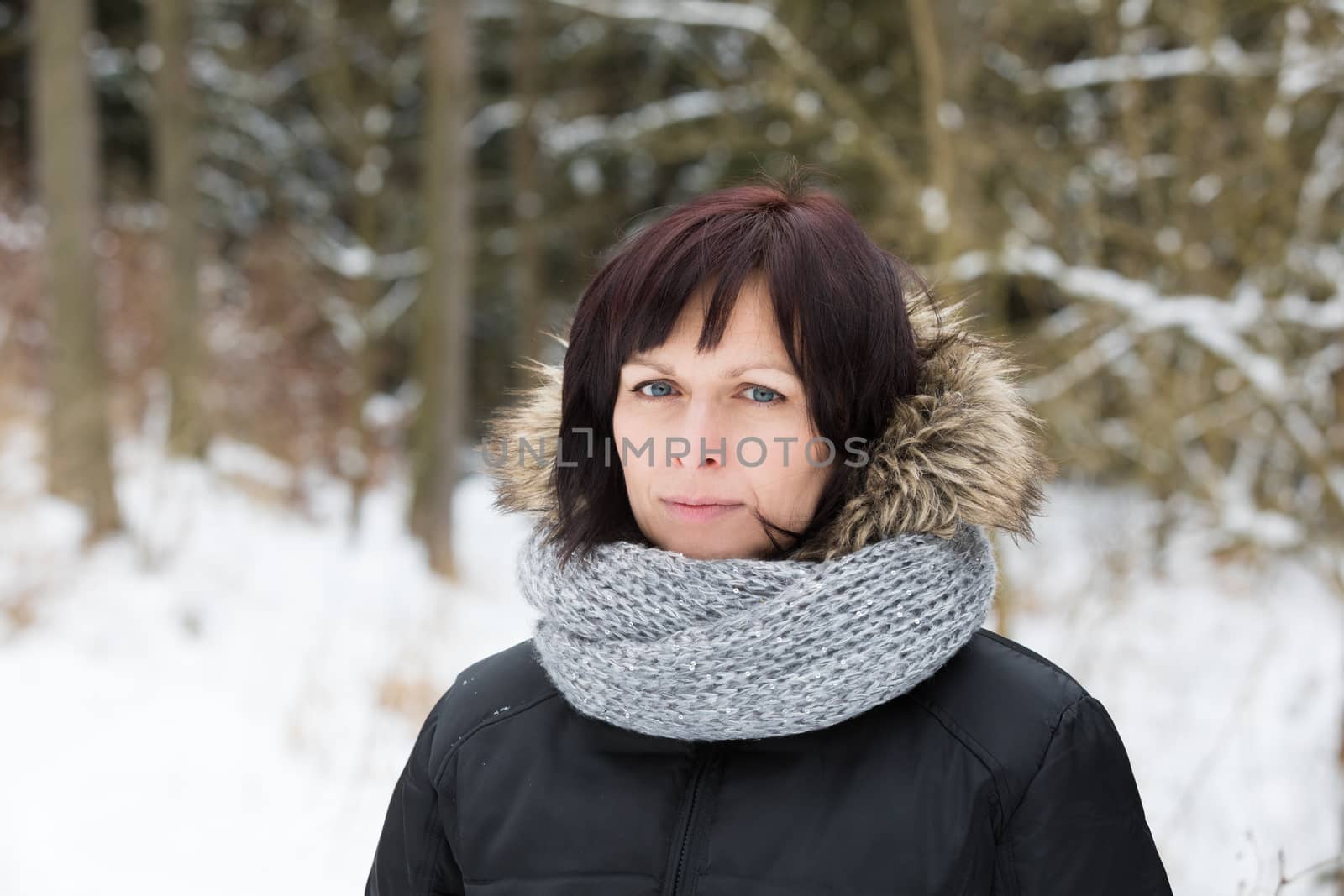 portrait of happy middle age woman without makeup in winter time