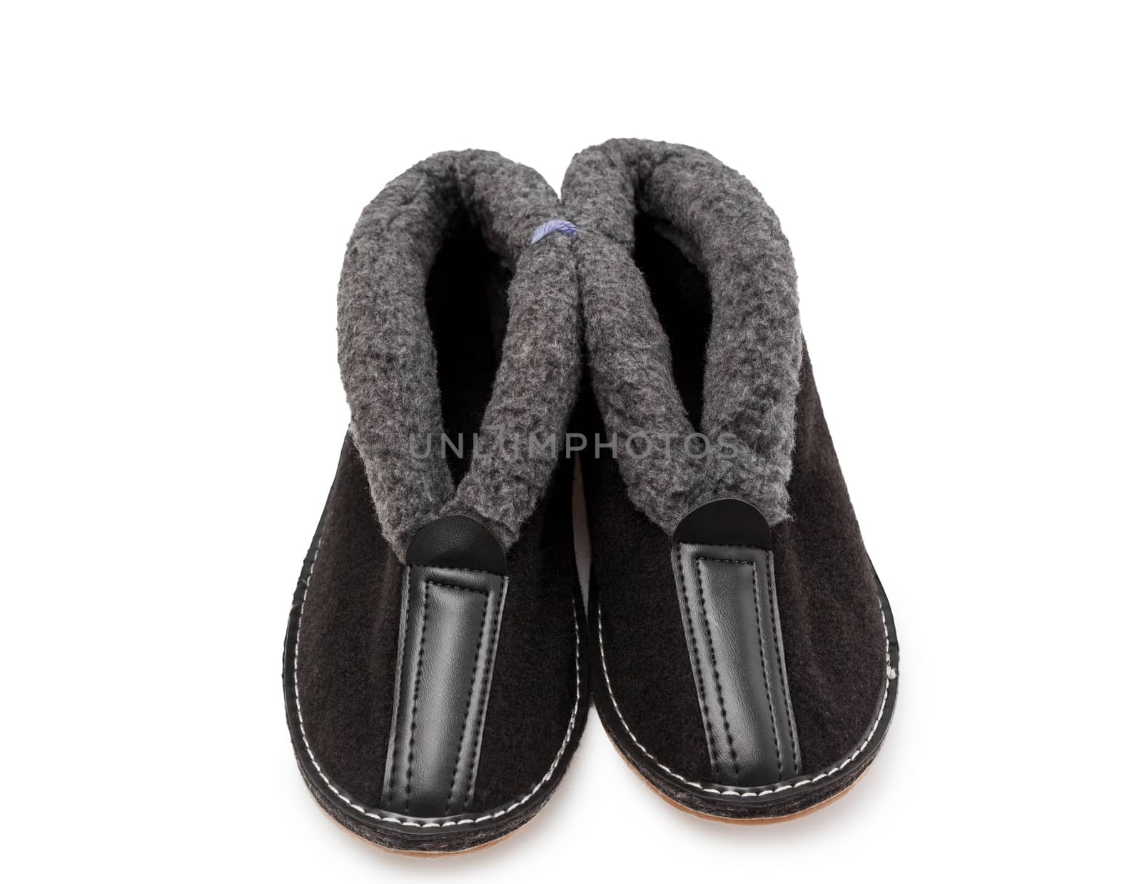 Slippers made of felt and fur in white background